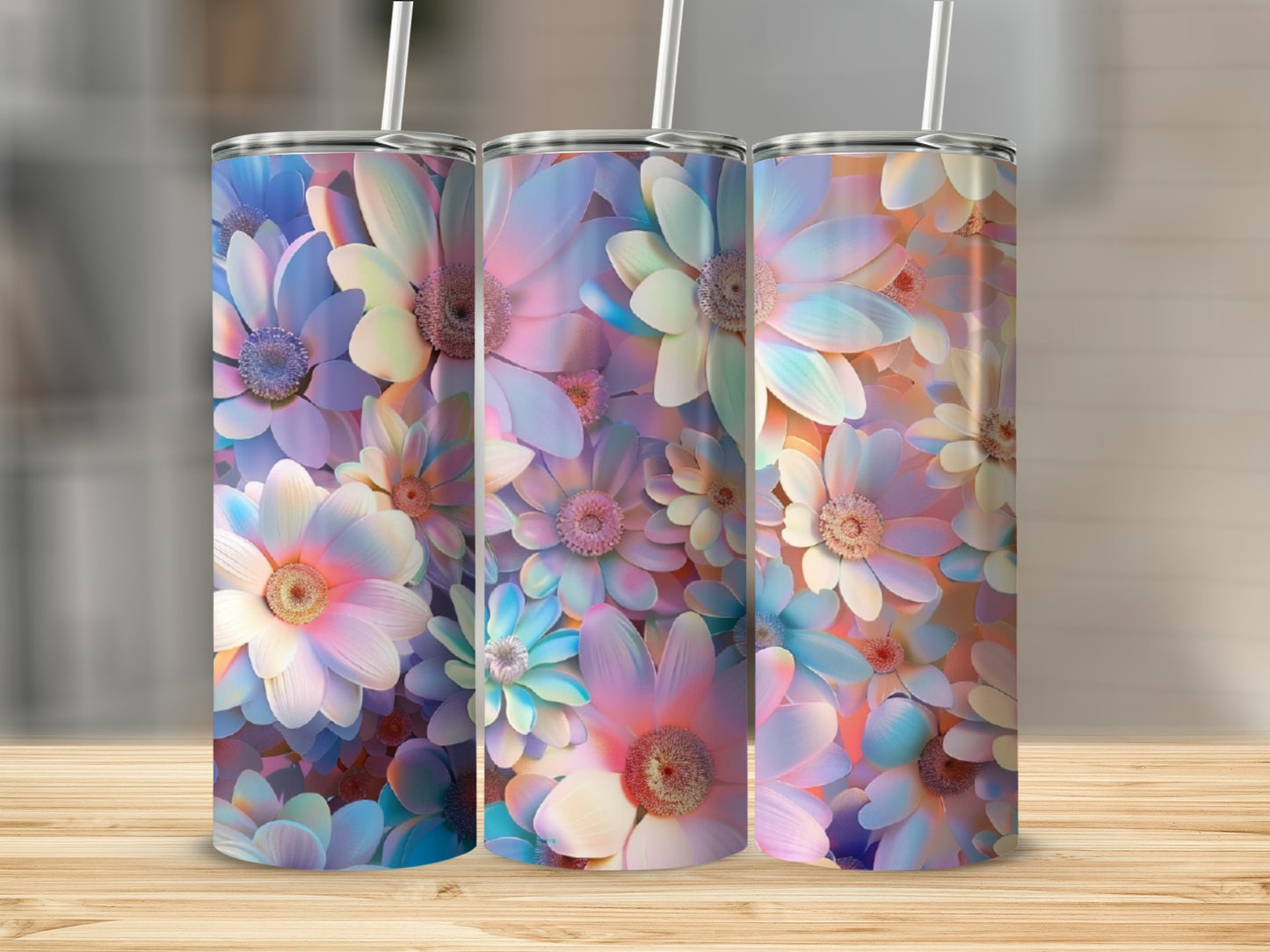 Three tumblers with floral designs in pastel colors.