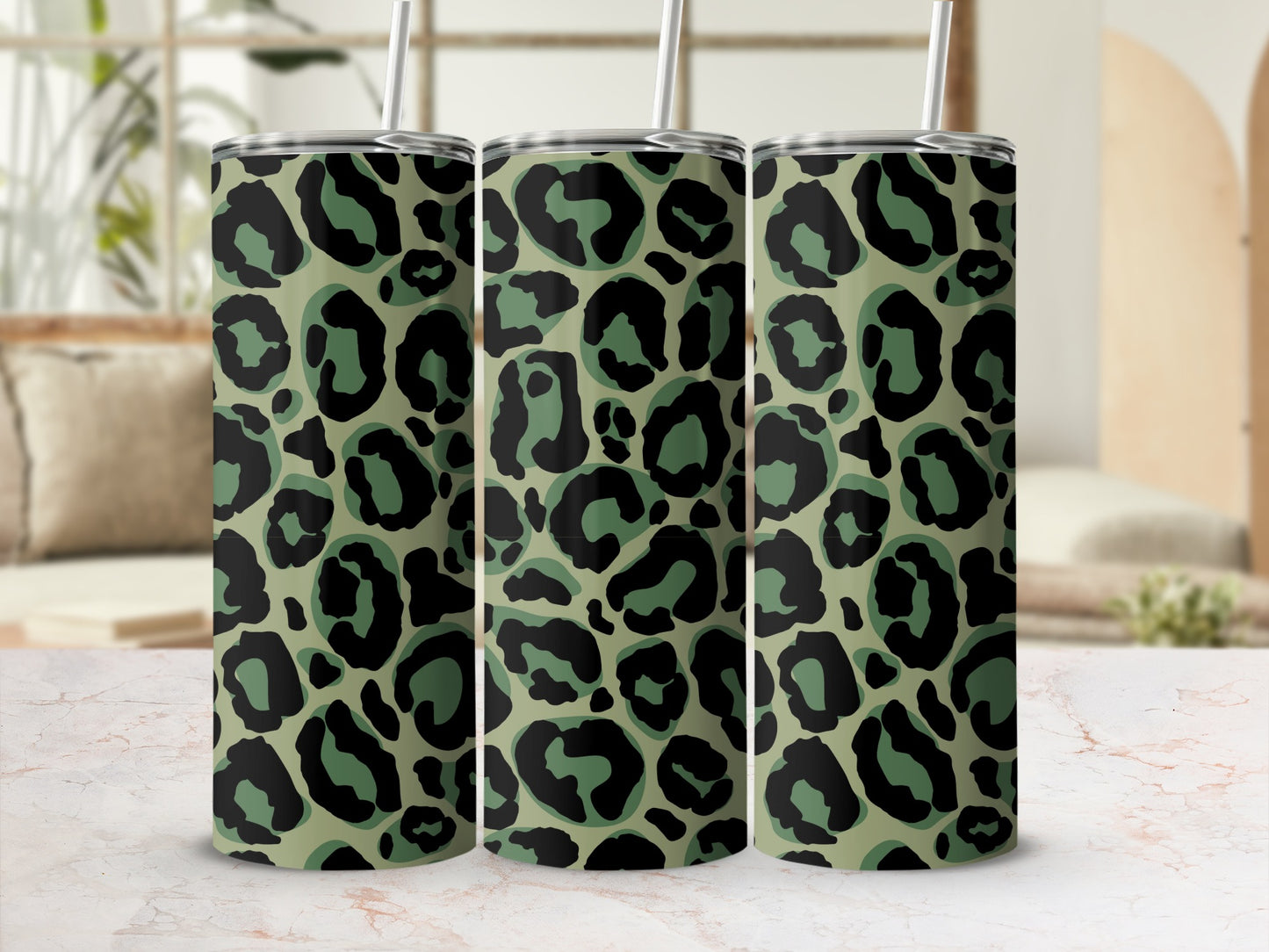 Three tumblers with a green and black leopard print pattern.