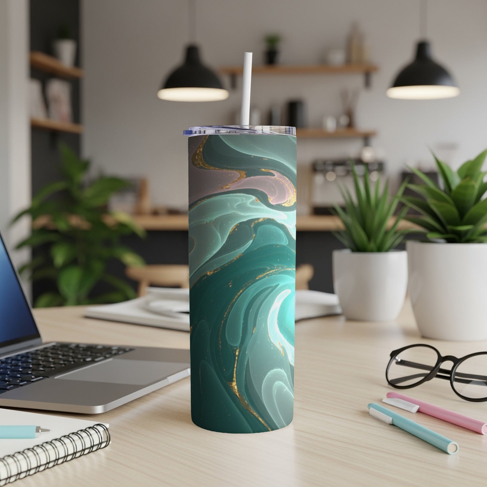 Abstract marbled tumbler with gold accents and a white straw.