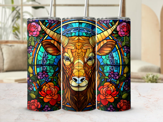 Stained glass tumbler featuring a bull's head surrounded by flowers and blue and green mosaic.