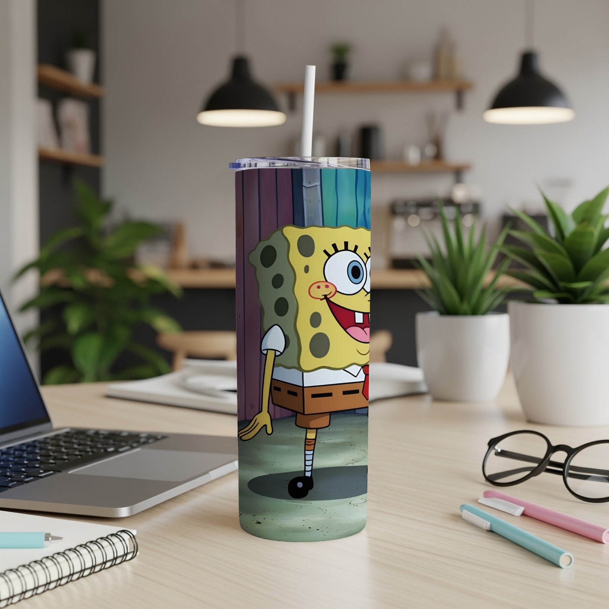 SpongeBob SquarePants standing on a colorful, striped tumbler with a straw.