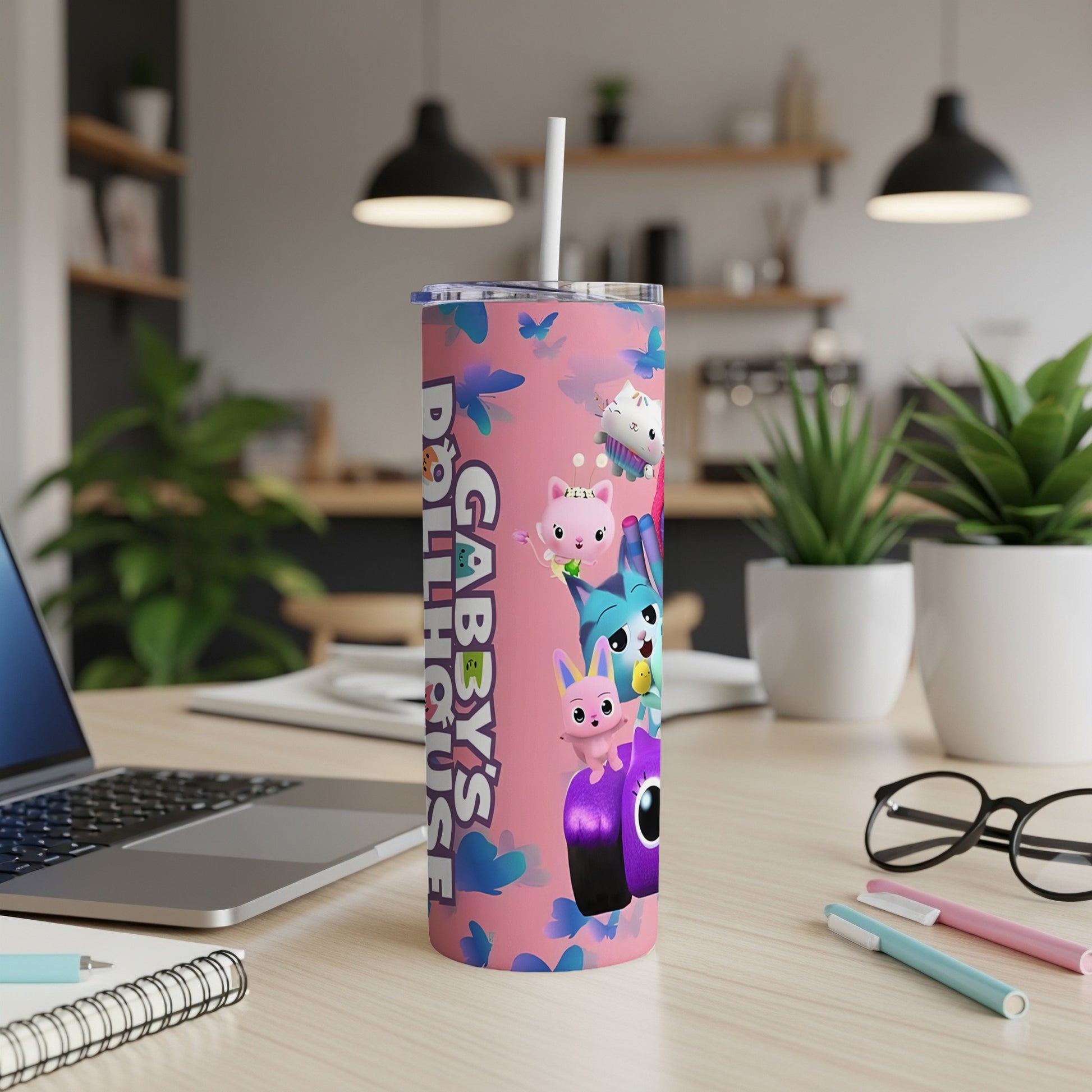 Gabby's Dollhouse characters on a pink tumbler with a blue cloud pattern.