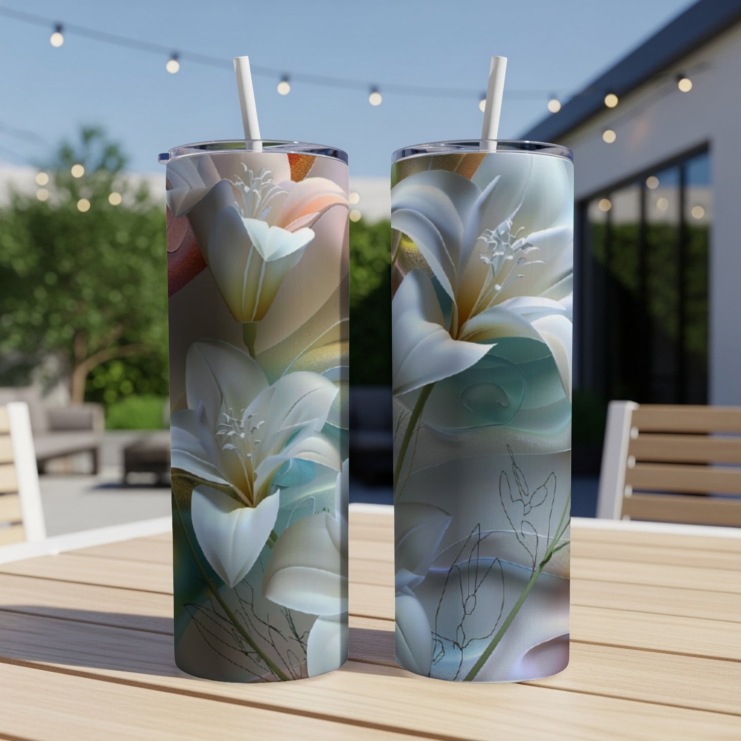 Two tumblers with a floral design featuring white lilies on a wooden table.
