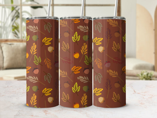 Three brown tumblers with a fall leaf and acorn pattern.