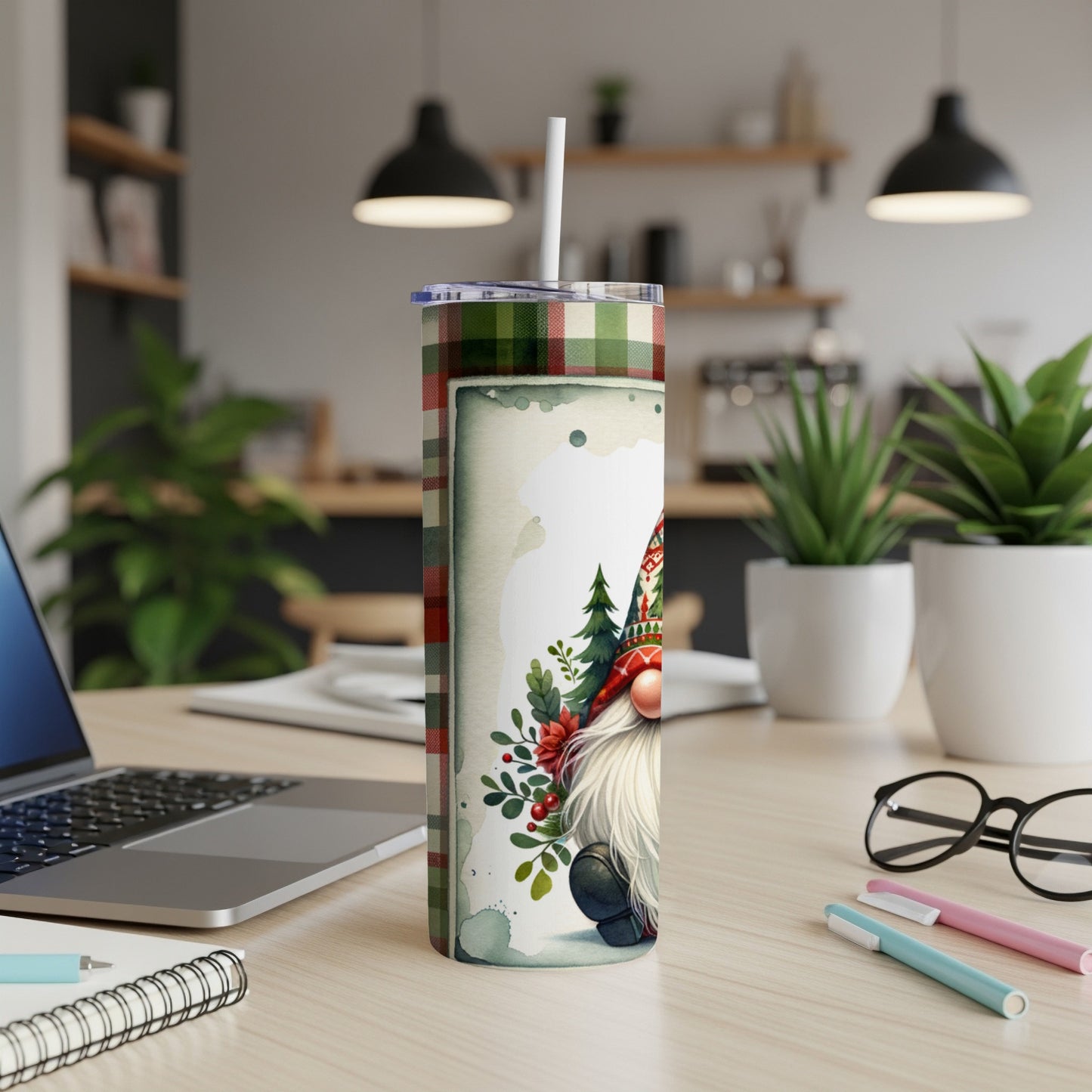 Tumbler featuring a gnome with a plaid and holly pattern.