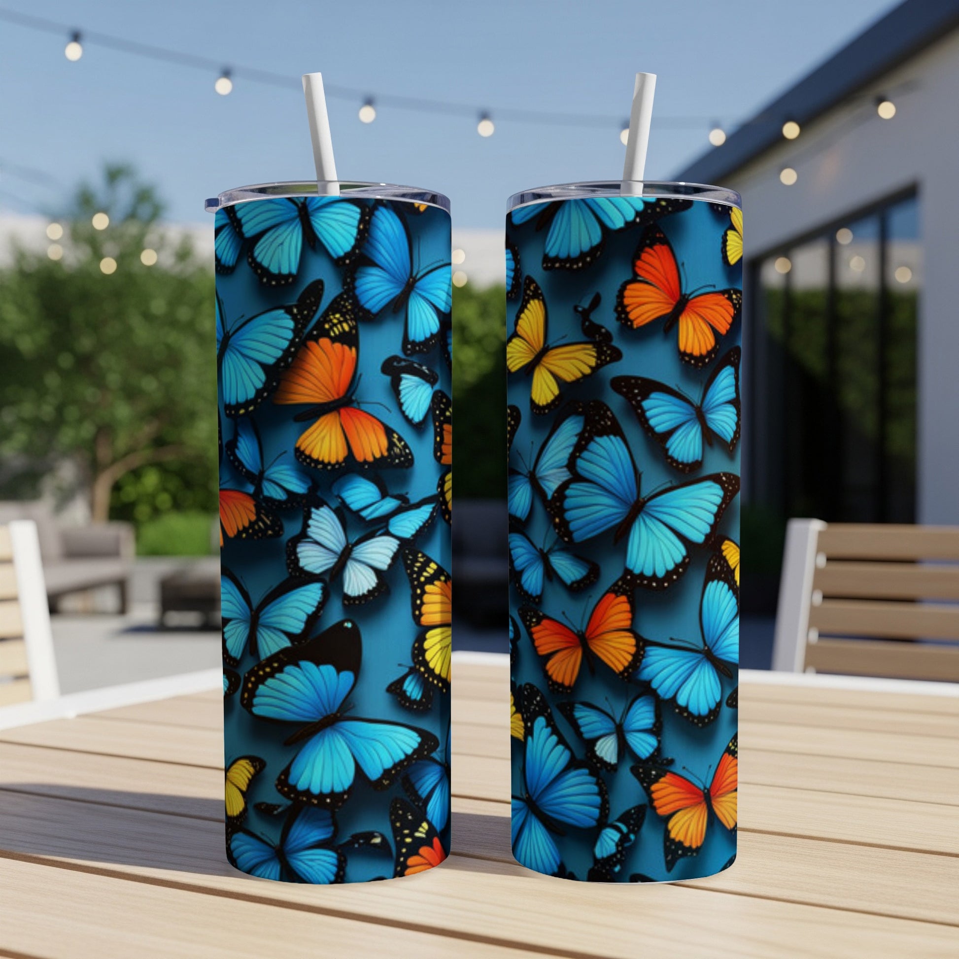 Two tumblers with blue and orange butterfly patterns.