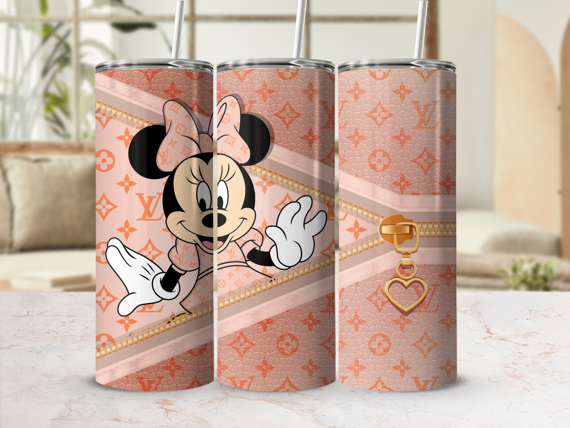 Minnie Mouse on a peach tumbler with gold zipper and heart charm.