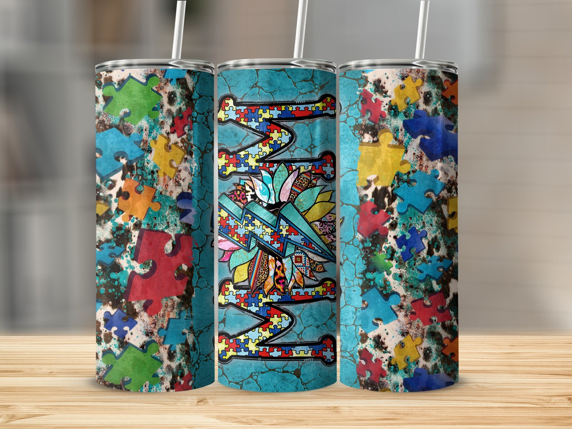 Autism awareness puzzle piece design on a set of three tumblers.