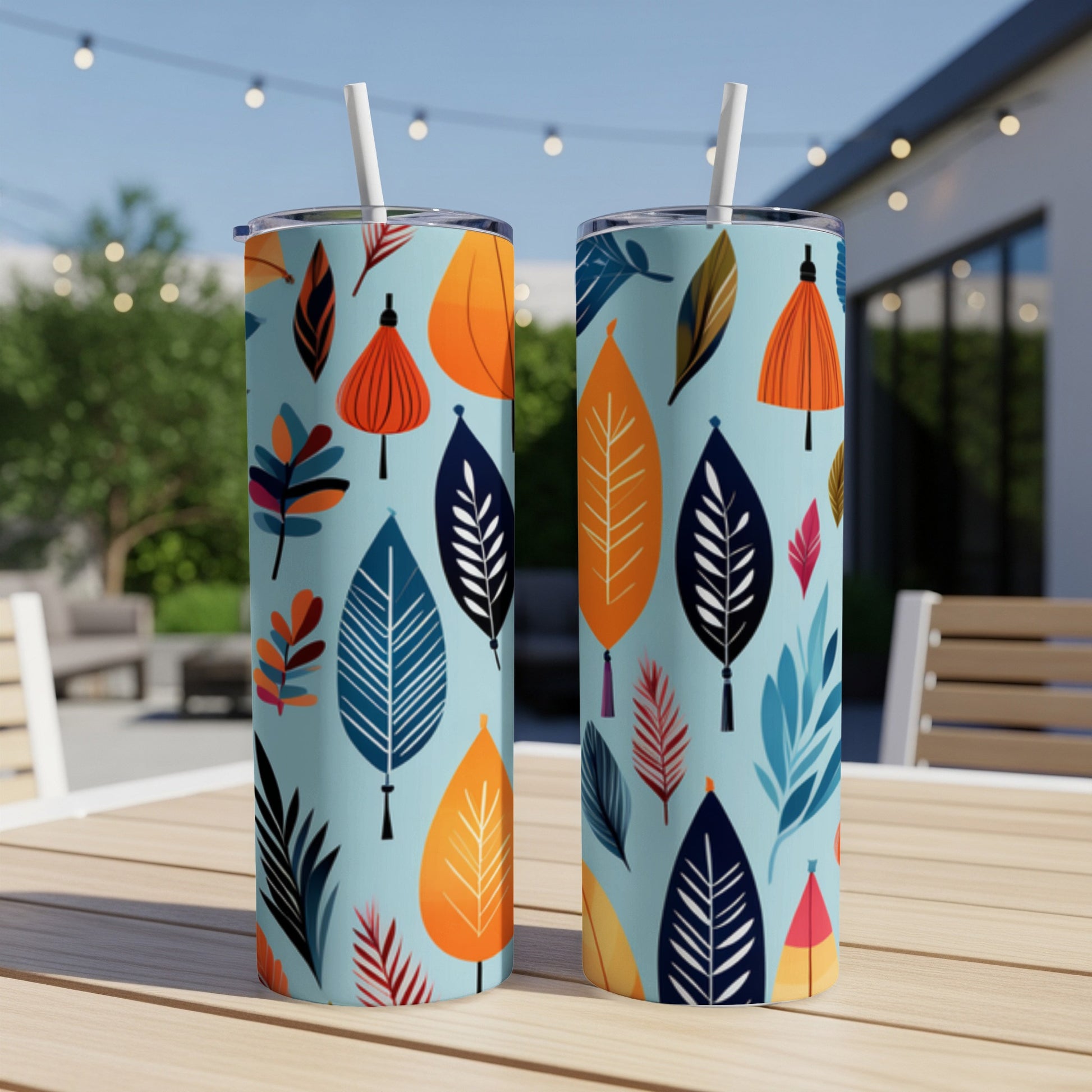 Two tumblers with a teal background and a repeating pattern of stylized leaves.