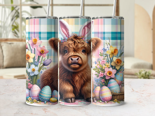 Highland cow with bunny ears, Easter eggs, and flowers on plaid tumbler.
