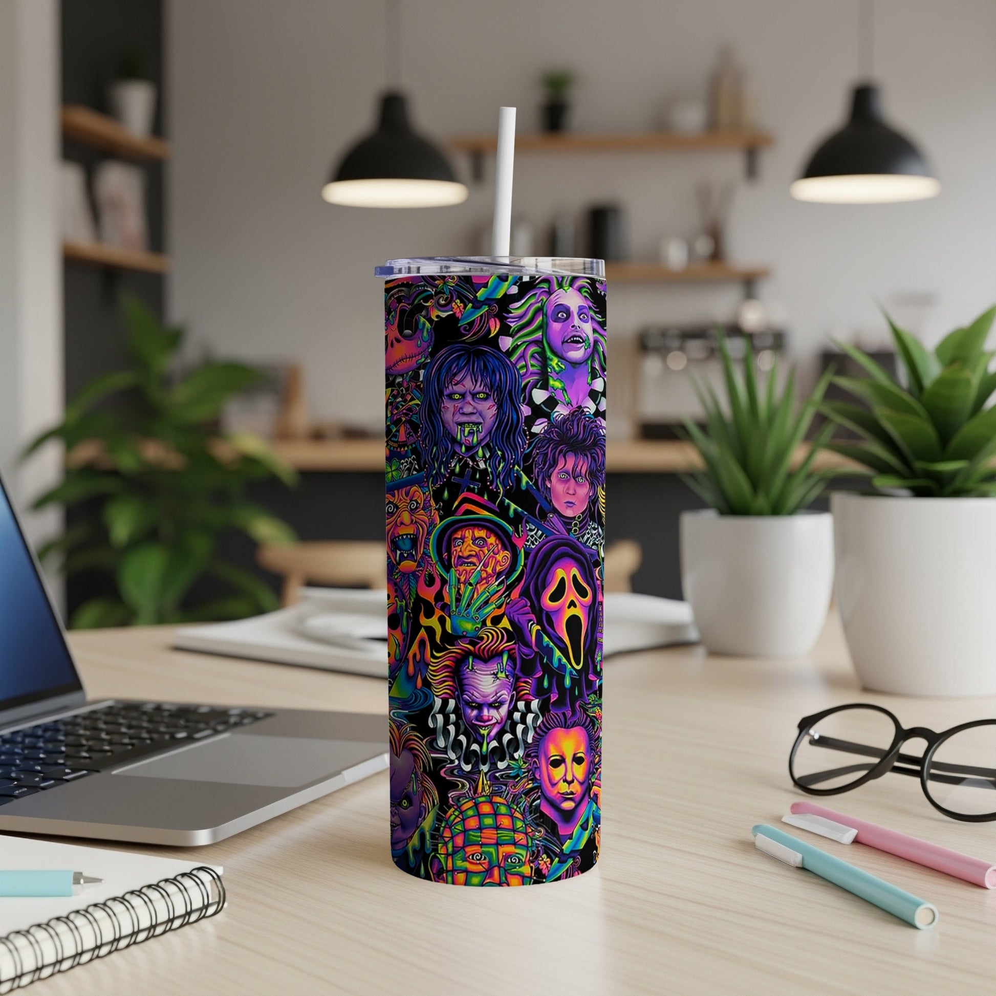 Tumbler with a collage of horror movie villains and characters in vibrant colors.