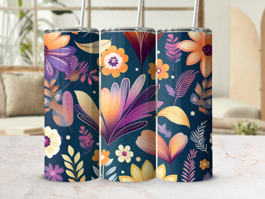 Three tumblers with a floral pattern on a marbled surface.