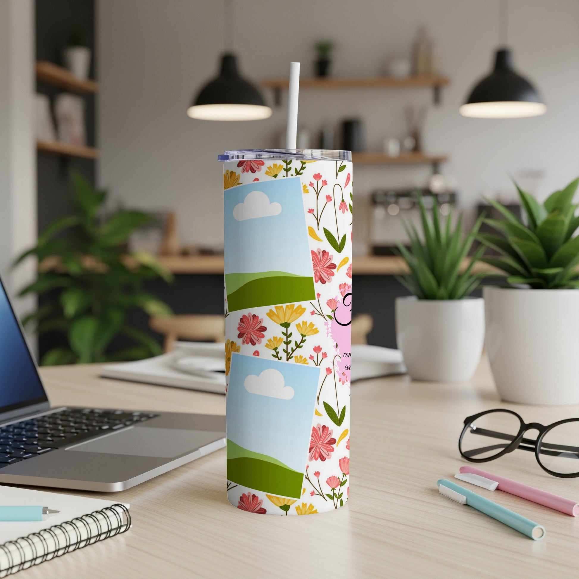Tall tumbler with floral pattern and photo placeholders on a desk.