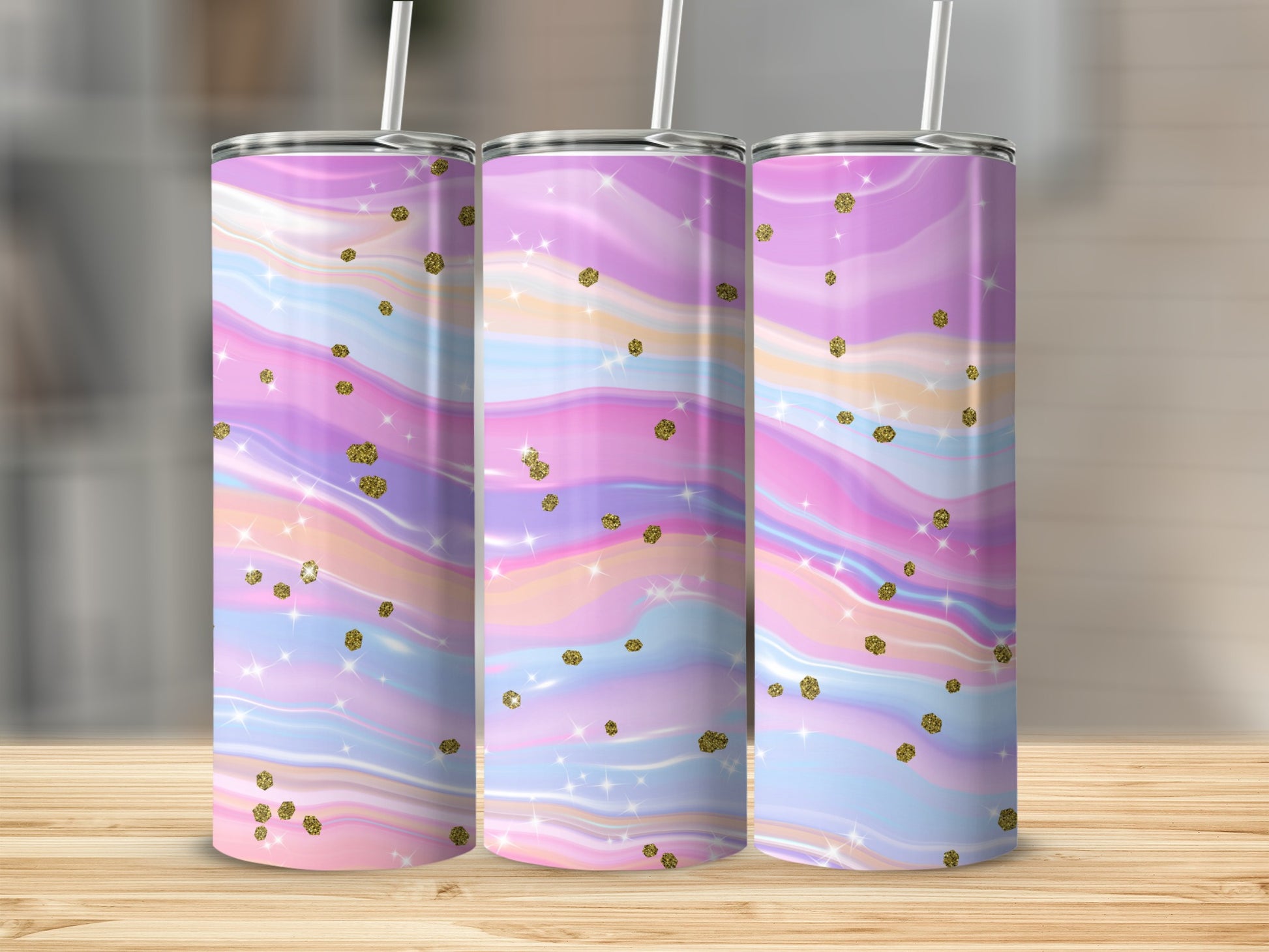 Three tumblers with pastel marble pattern and gold glitter accents.