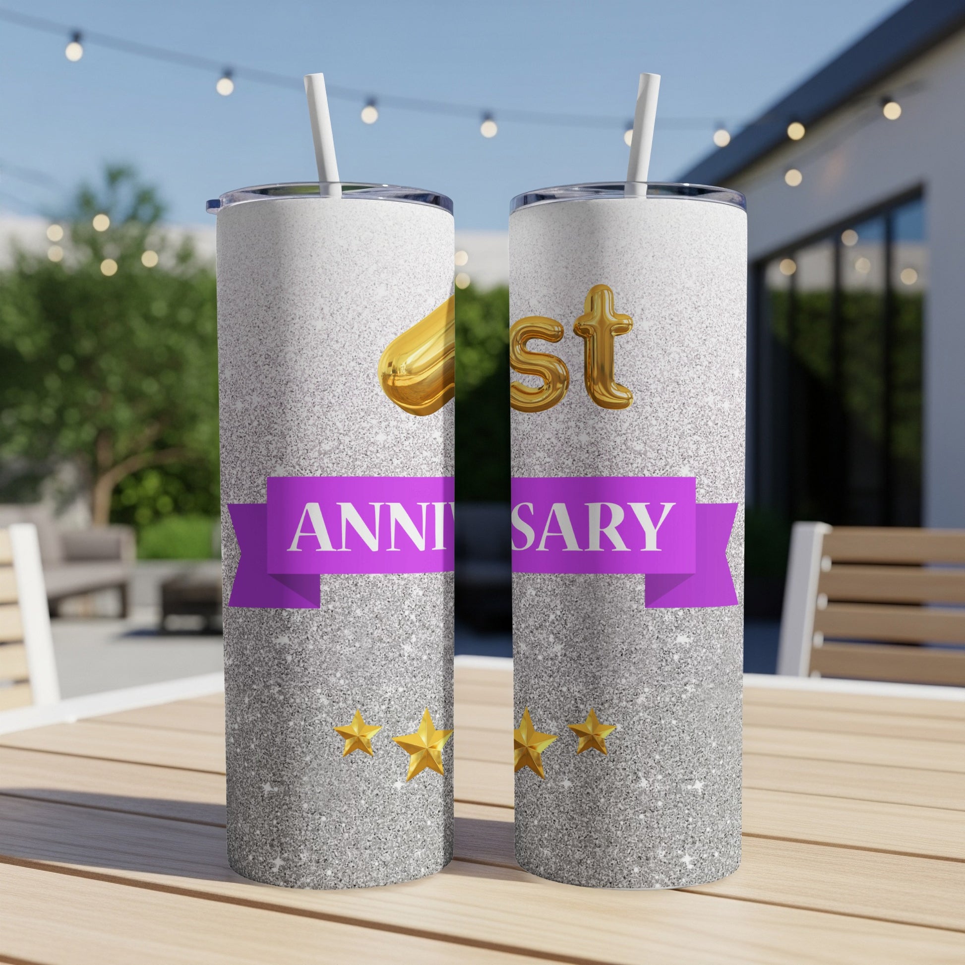 Glittery tumbler with "1st ANNIVERSARY" text and gold balloons.
