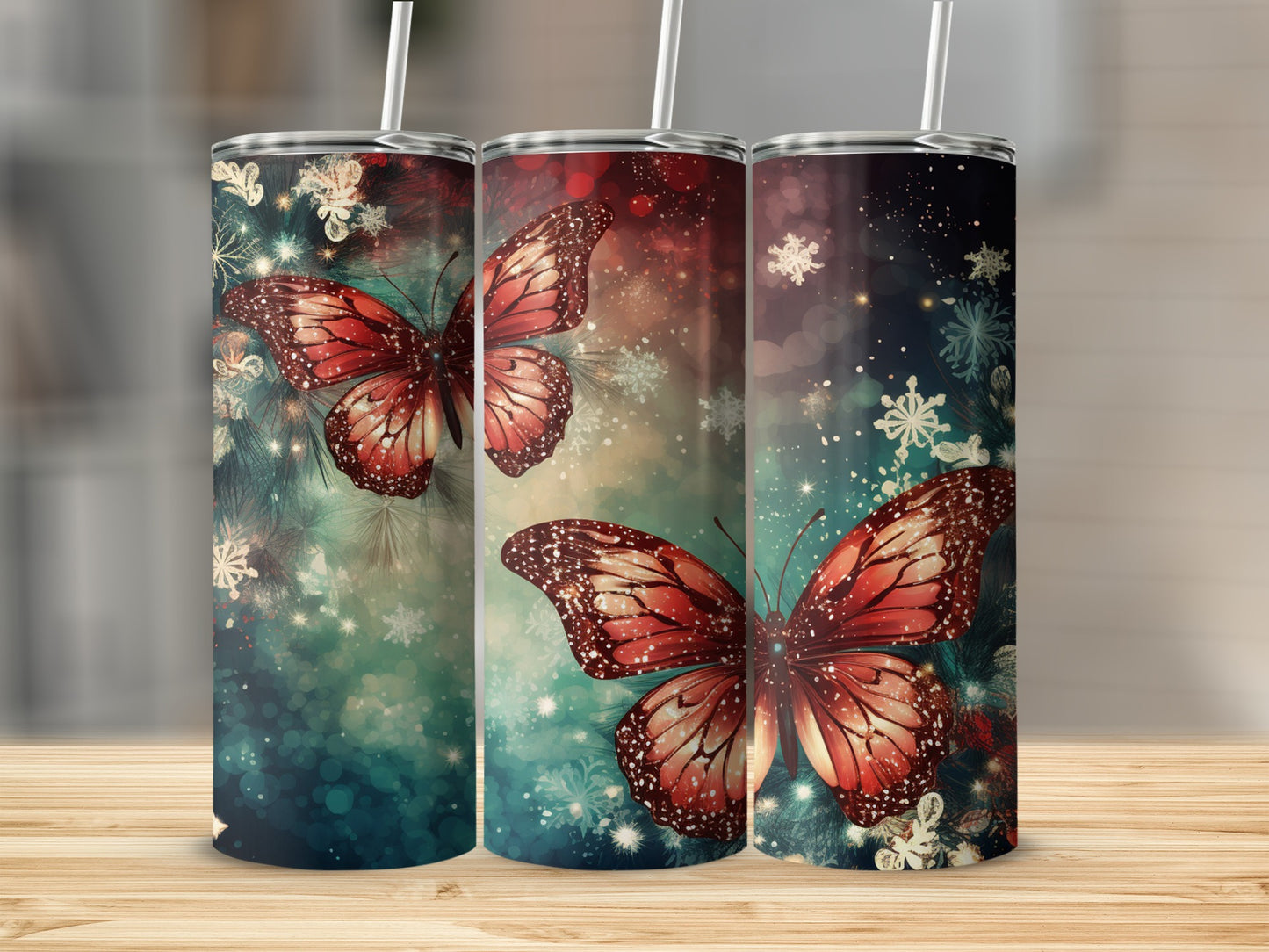 Three tumblers with red butterflies and snowflake designs.
