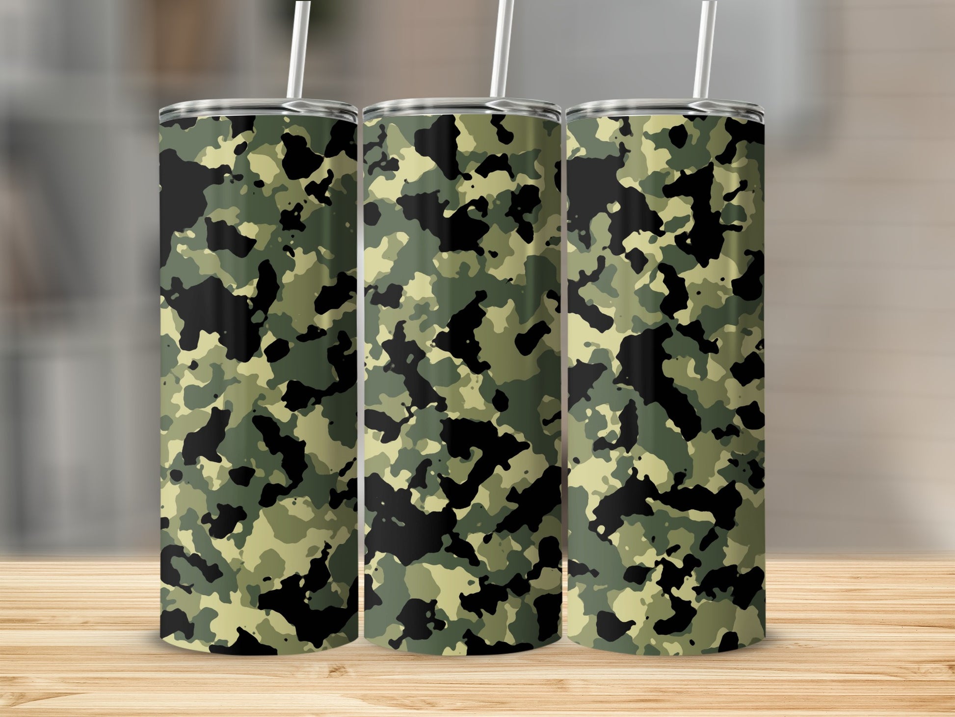 Three tumblers with a green, black, and light green camouflage pattern.