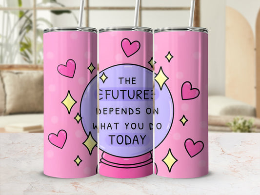 Pink tumbler with crystal ball, hearts, and stars, reading "The future depends on what you do today."