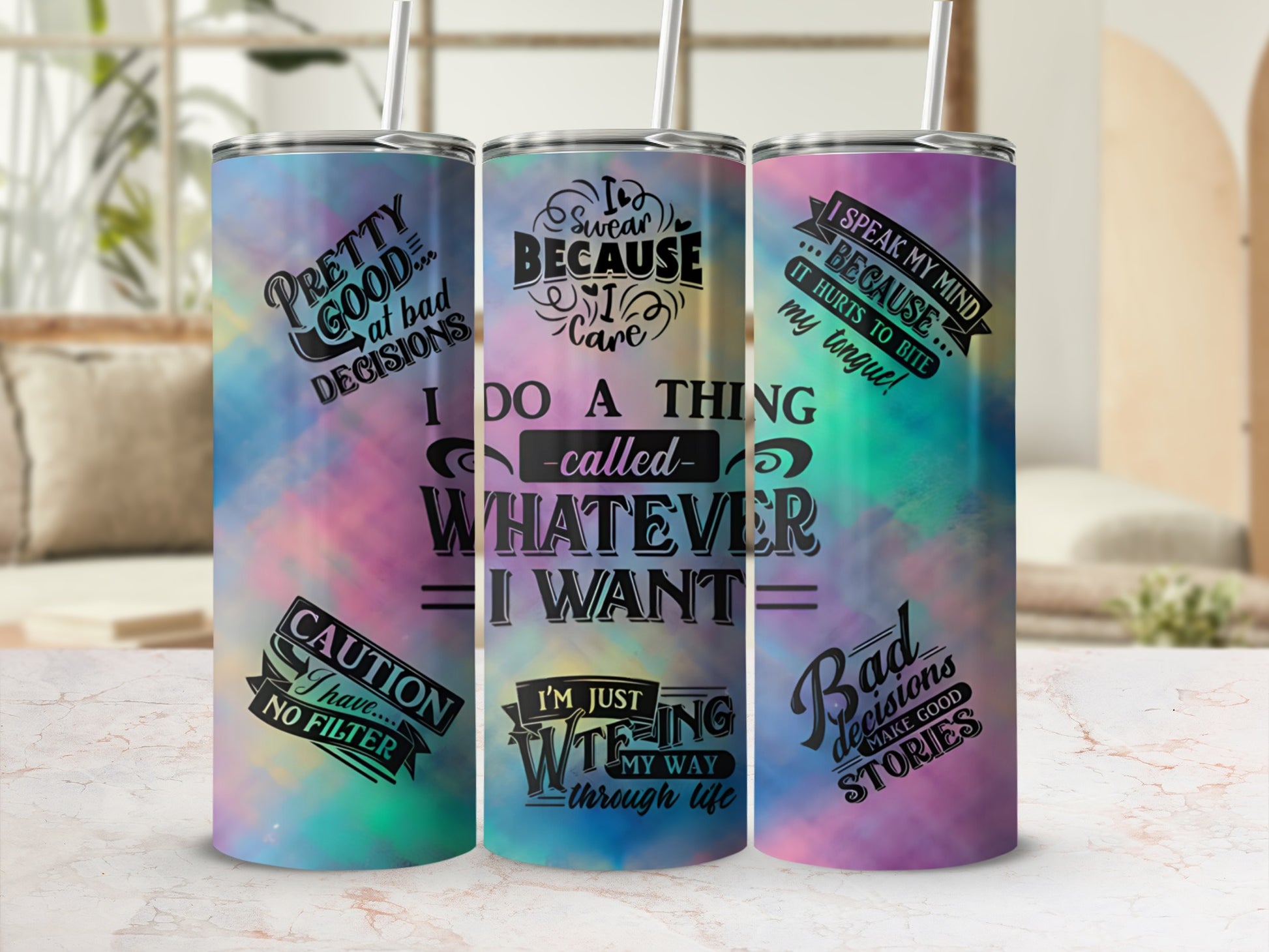 Tumblers with inspirational quotes and colorful tie-dye patterns.