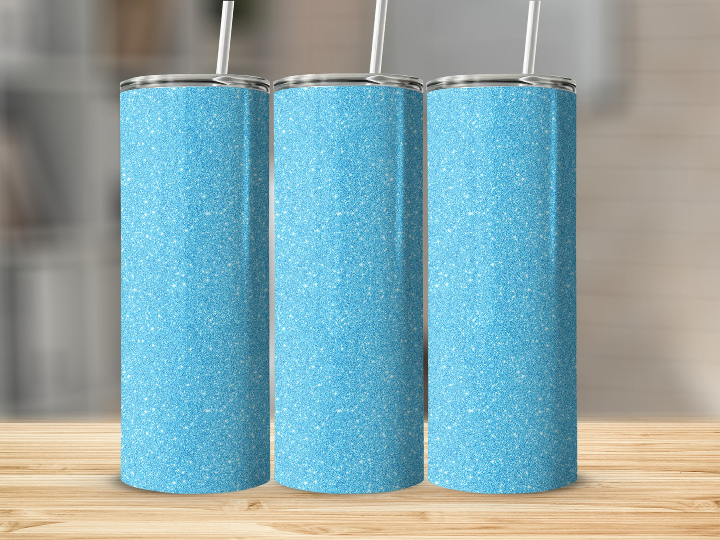 Three light blue glitter tumblers with white straws and silver lids.