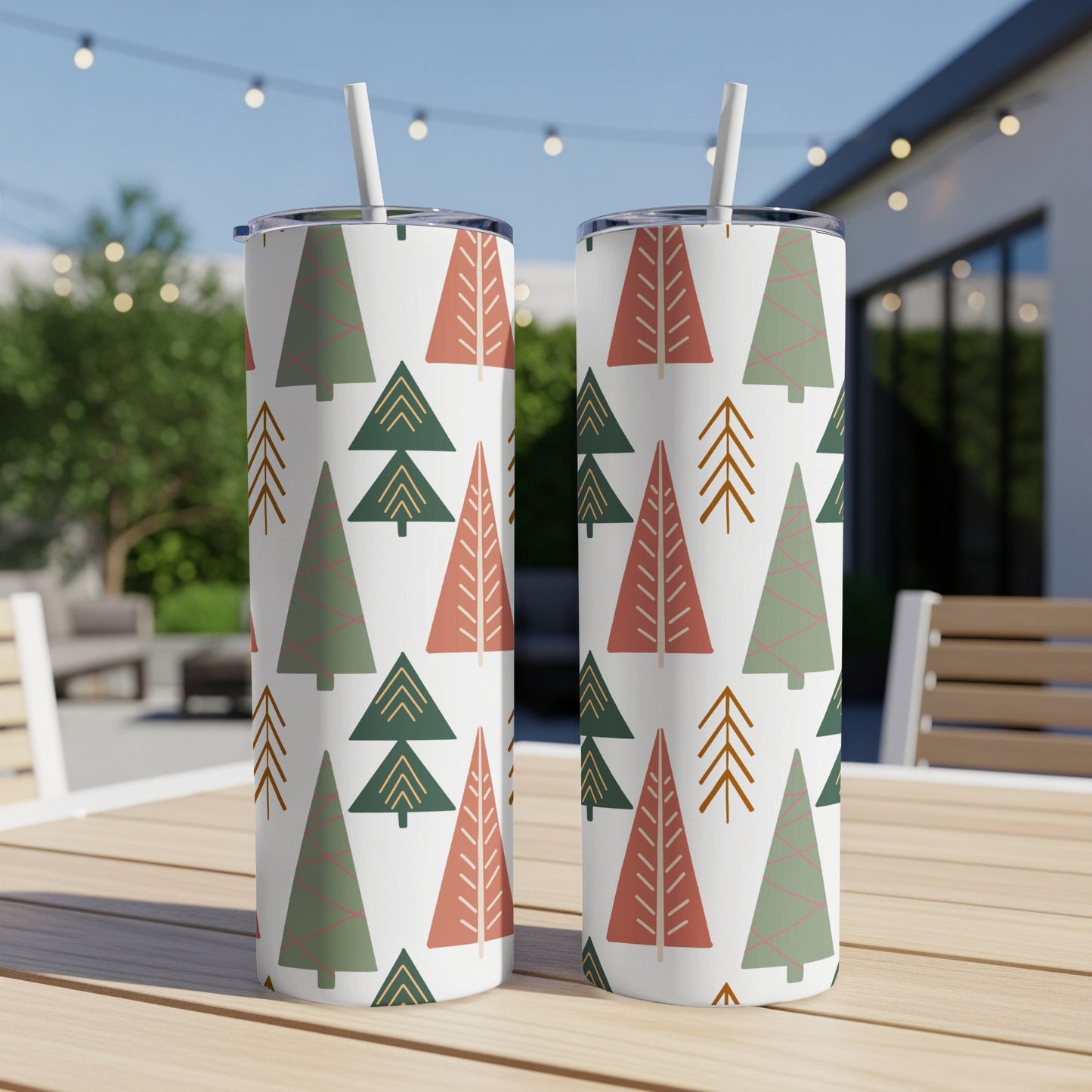 Two tumblers with a repeating pattern of green and coral Christmas trees.
