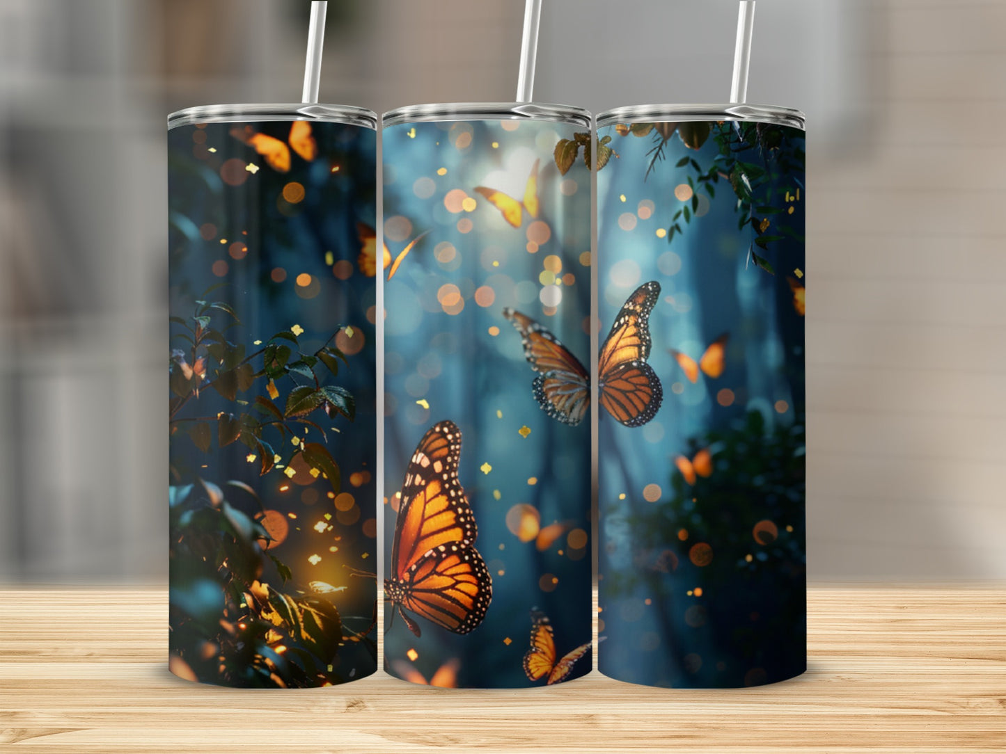 Three tumblers featuring an enchanted forest scene with orange butterflies.