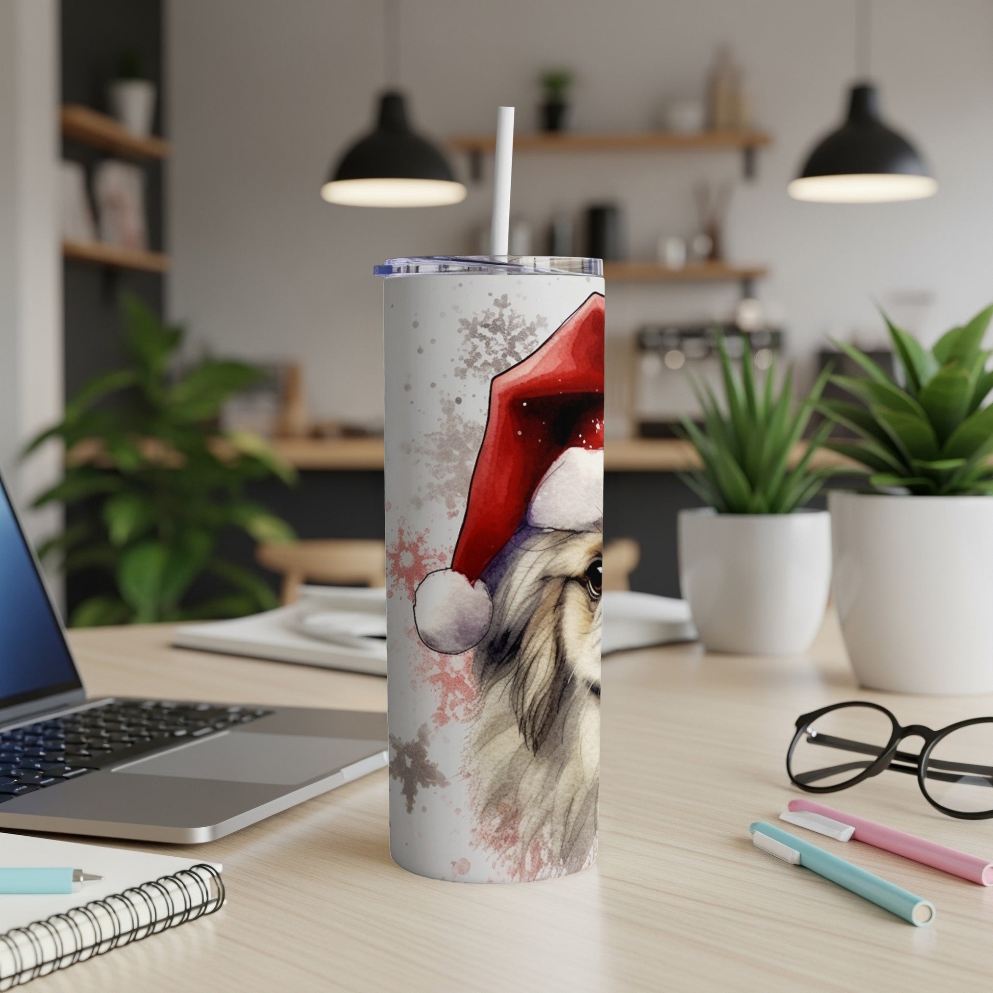 White tumbler with a painted dog wearing a Santa hat.