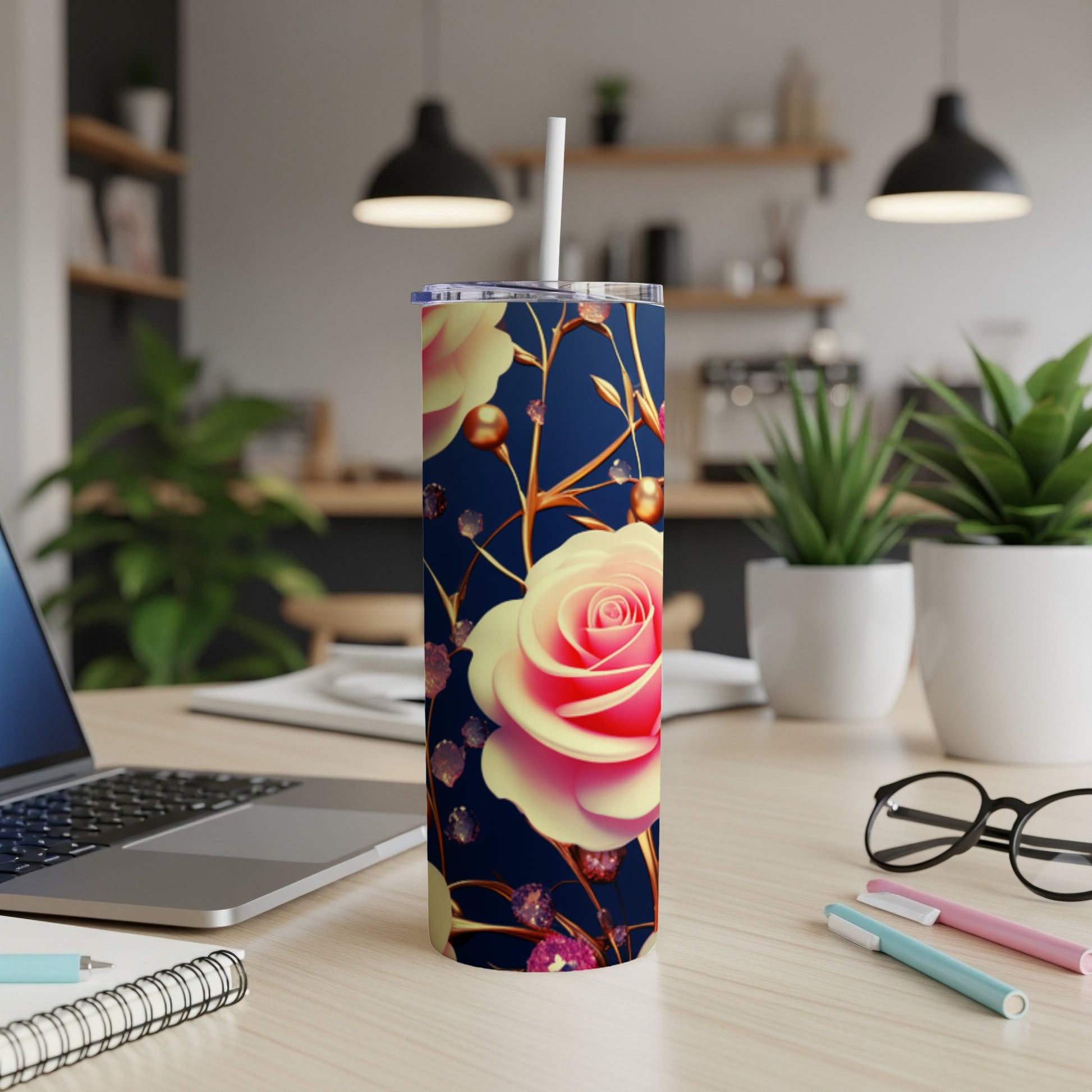 Pink and yellow roses on a navy blue tumbler with straw.