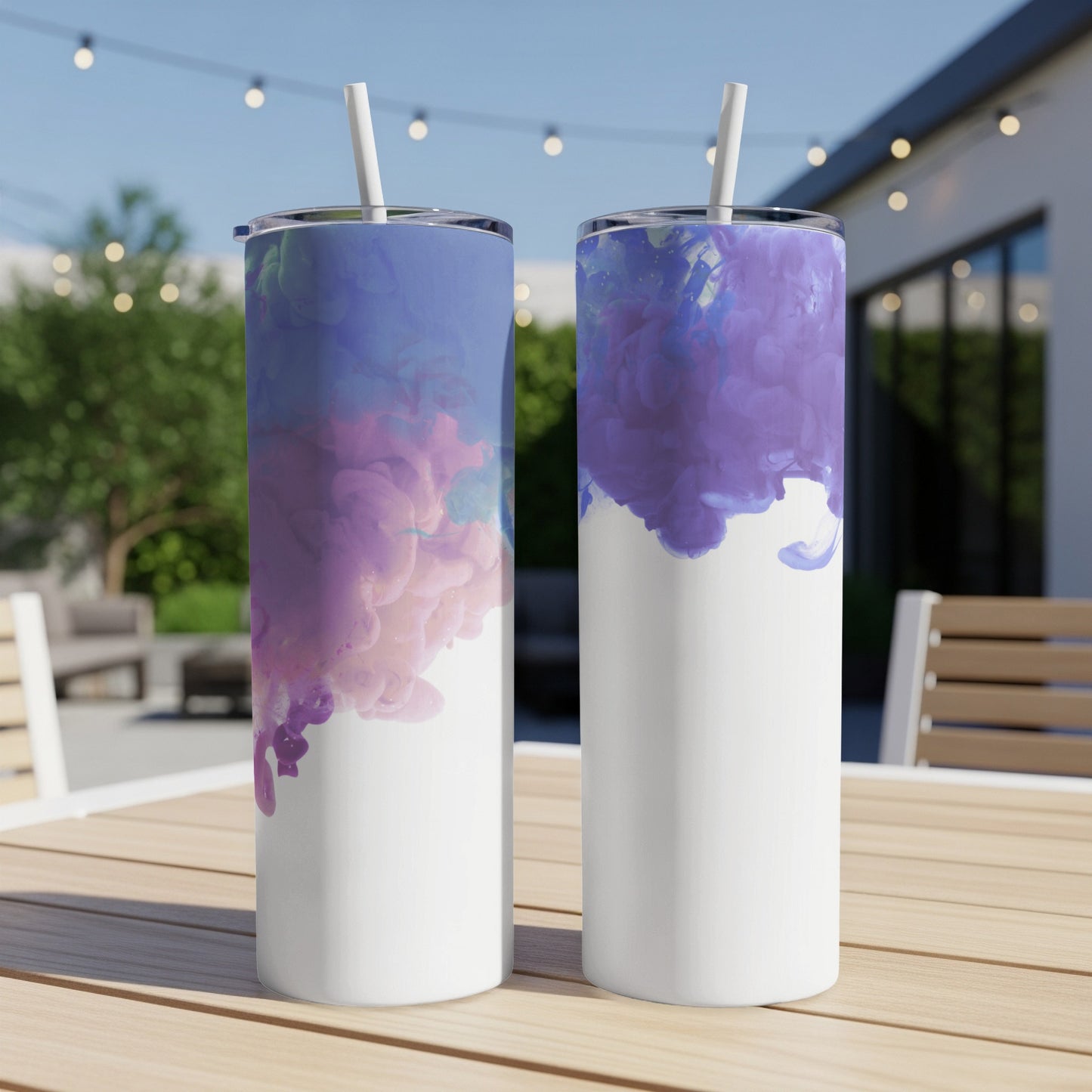 Two white tumblers with swirling purple and blue watercolor designs.