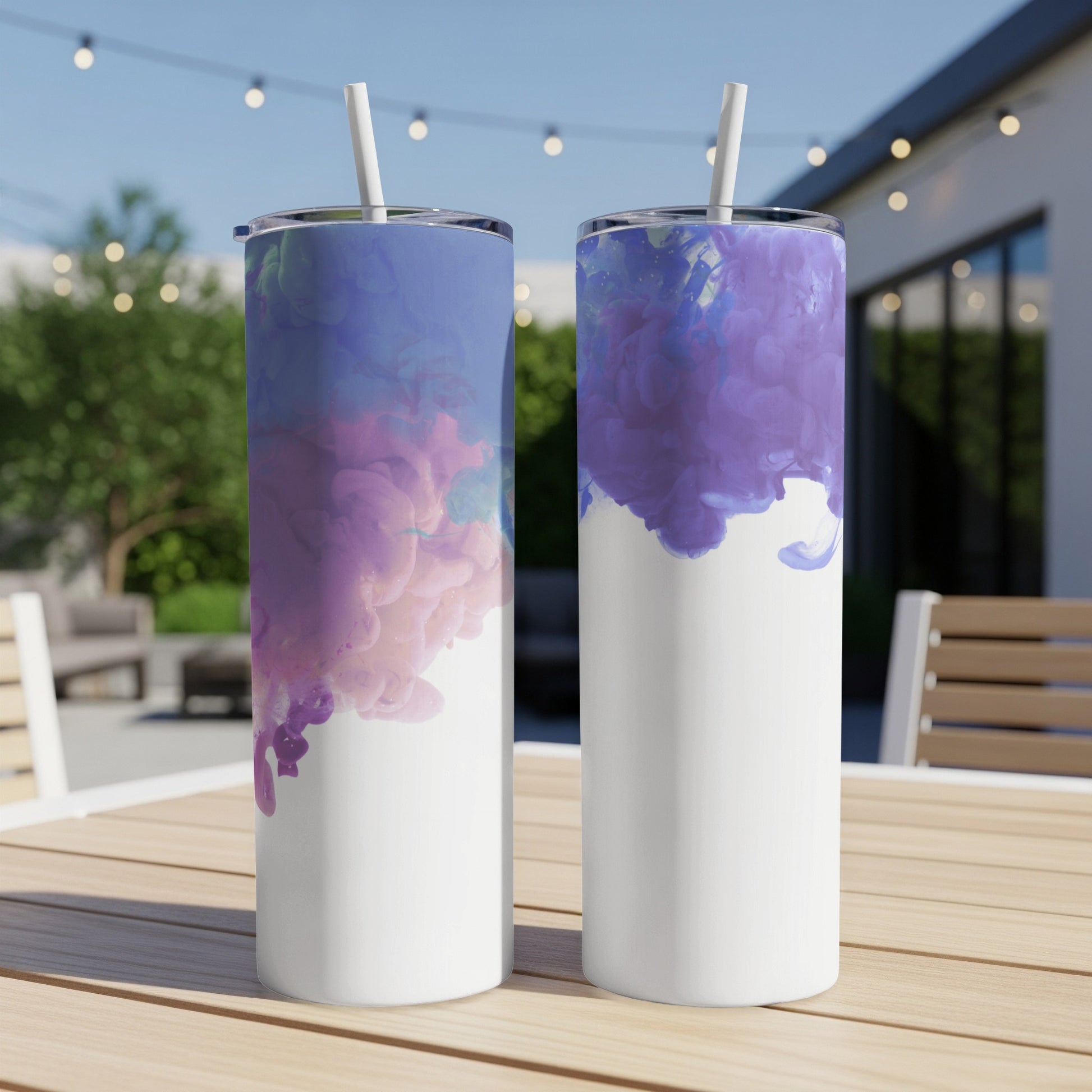 Two white tumblers with swirling purple and blue watercolor designs.