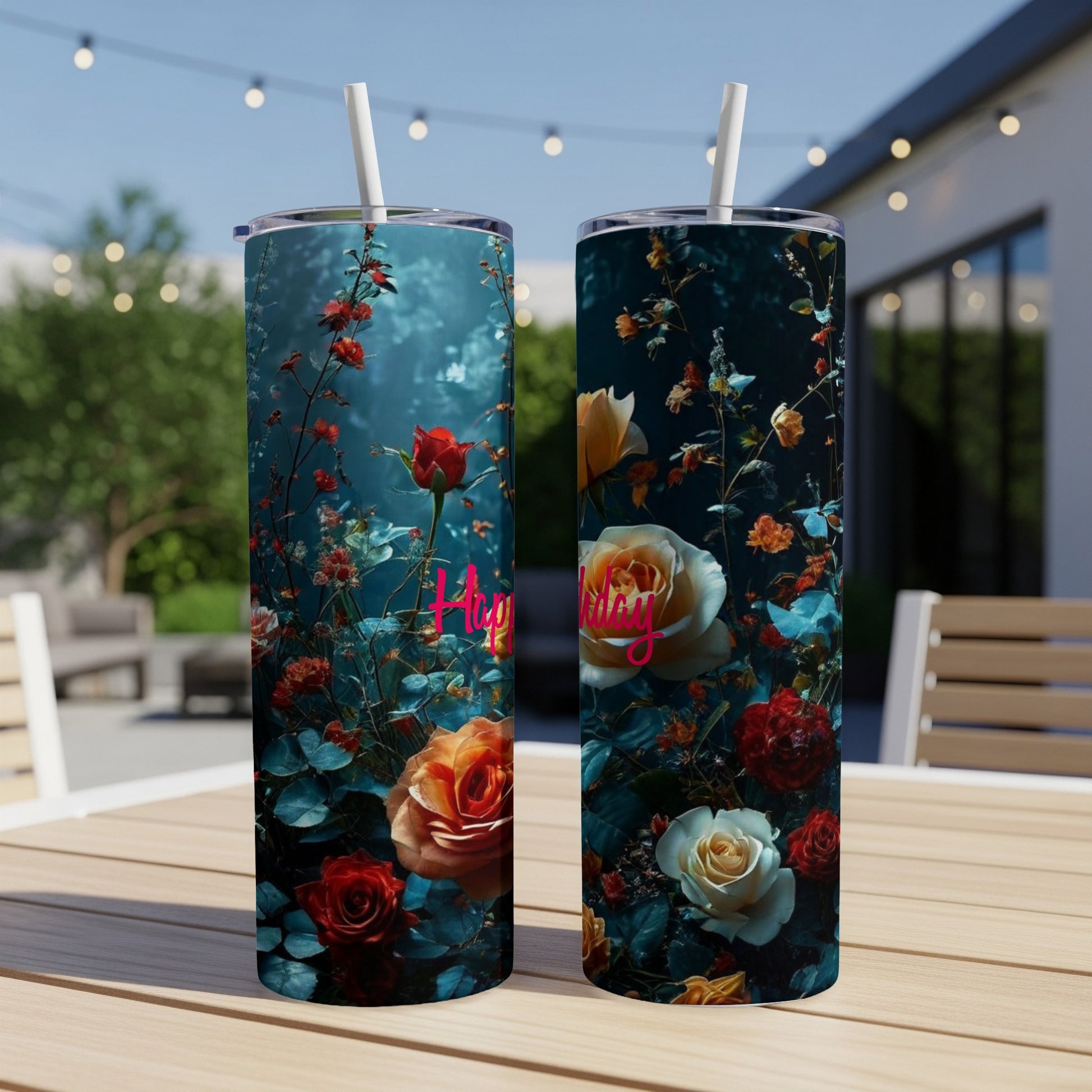 Two tumblers with a dark floral rose design, one reads "Happy".