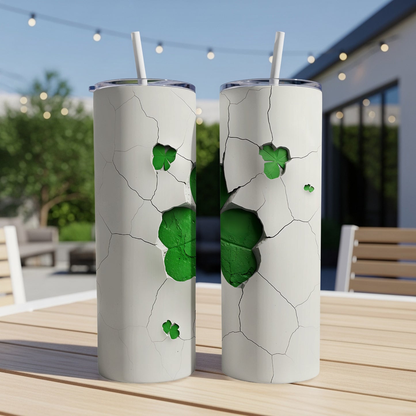 Two white tumblers with cracked design revealing green shamrocks.