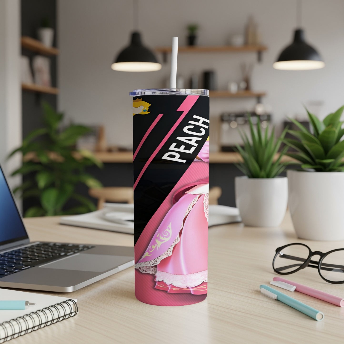Pink tumbler with "Peach" text, a light pink dress, and a white straw.