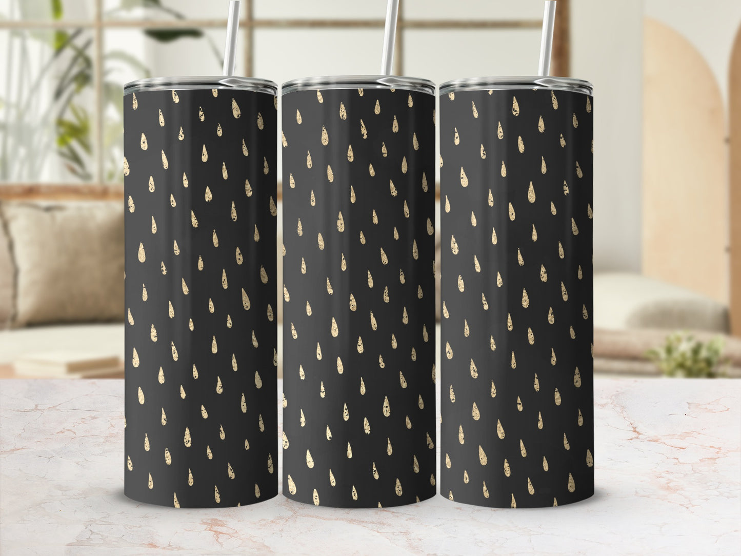 Three tumblers with a black background and a gold raindrop pattern.