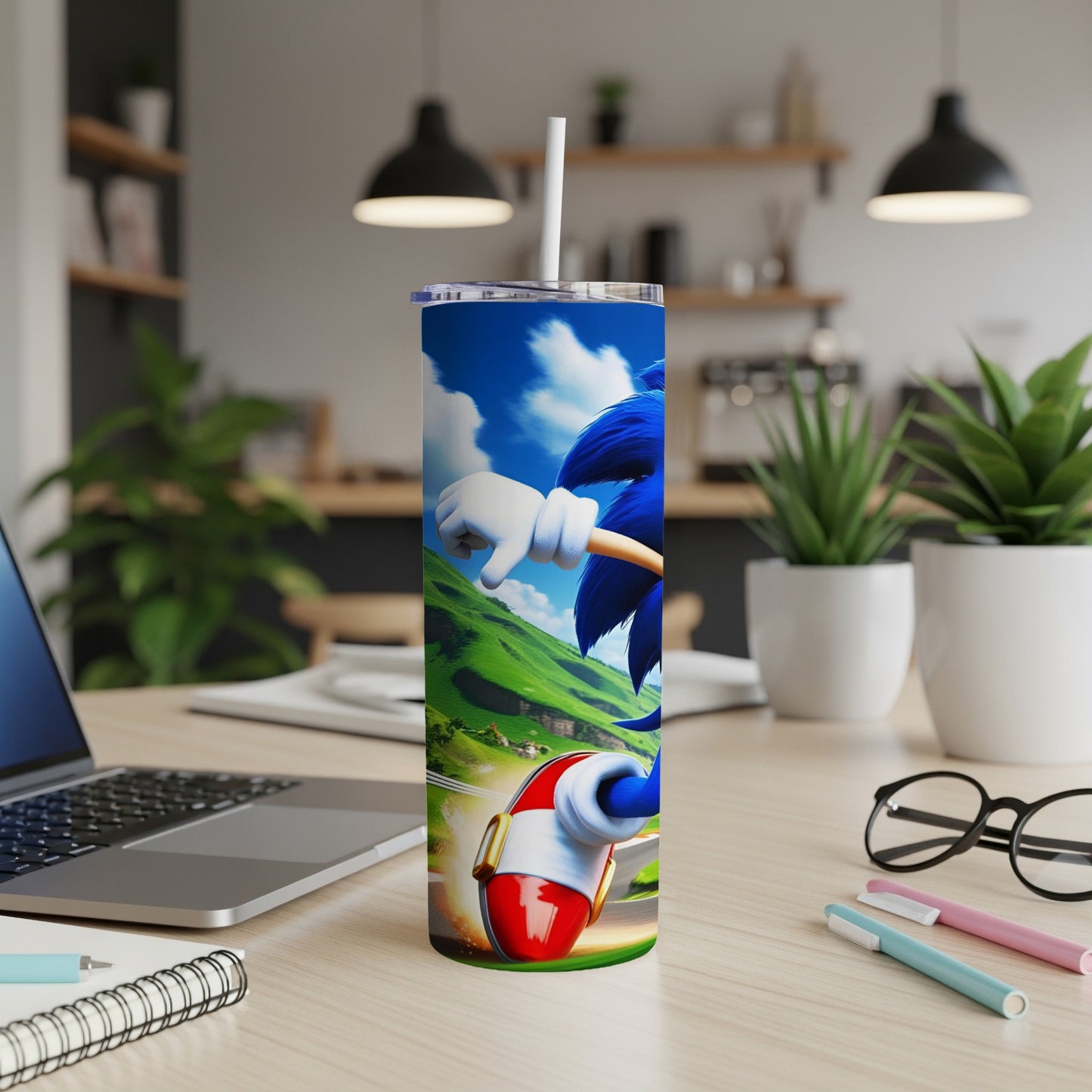 Sonic the Hedgehog on a tumbler with a white straw, on a desk.