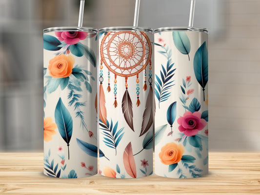 Three tumblers featuring dreamcatchers and floral designs on a wooden surface.
