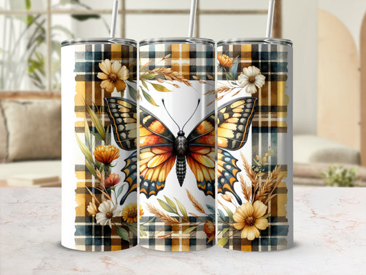 Butterfly and floral plaid pattern on a tumbler with straws.