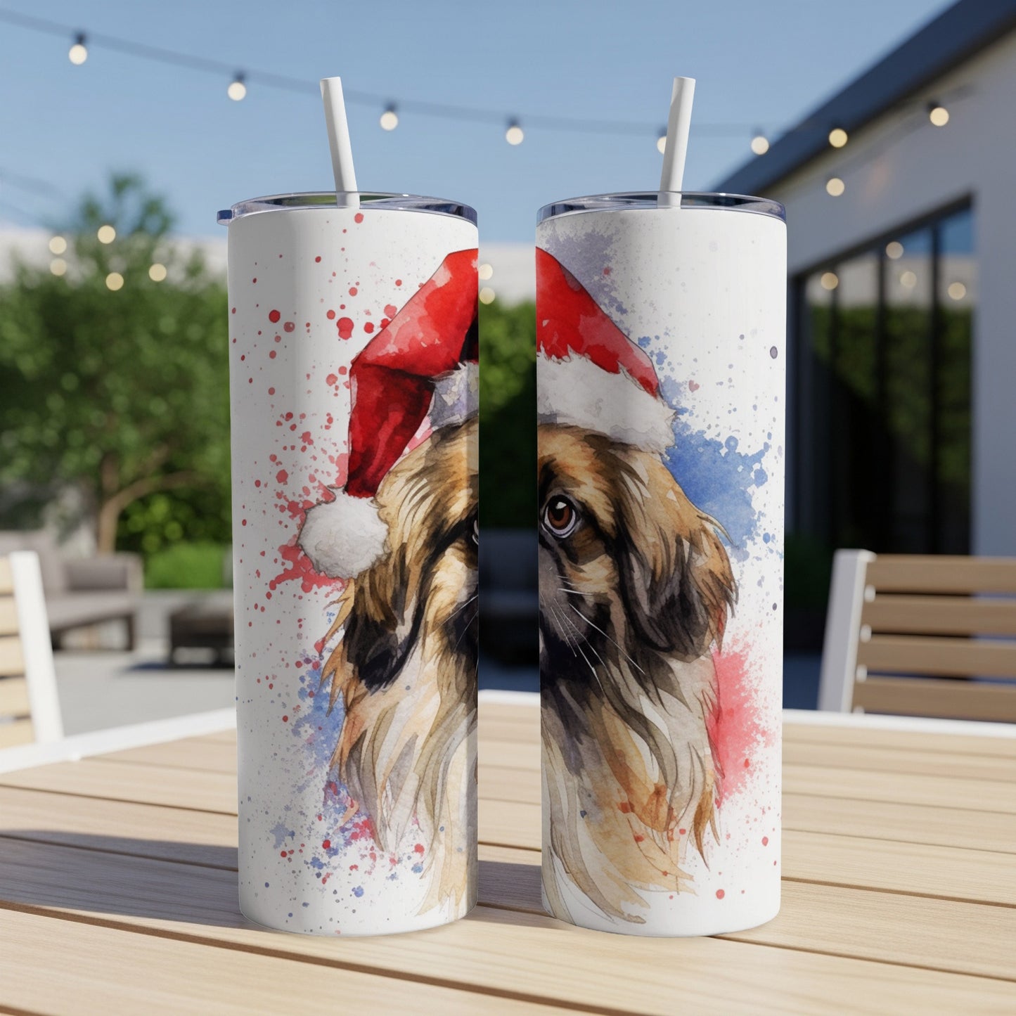 Two tumblers featuring a watercolor painting of a dog wearing a Santa hat.