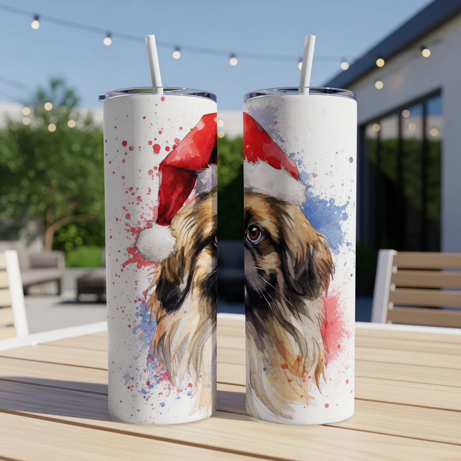 Two tumblers featuring a watercolor painting of a dog wearing a Santa hat.