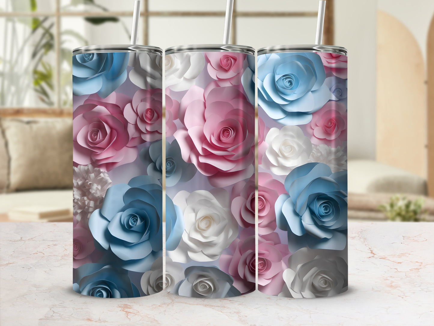 Three tumblers with a blue, pink, and white floral design.