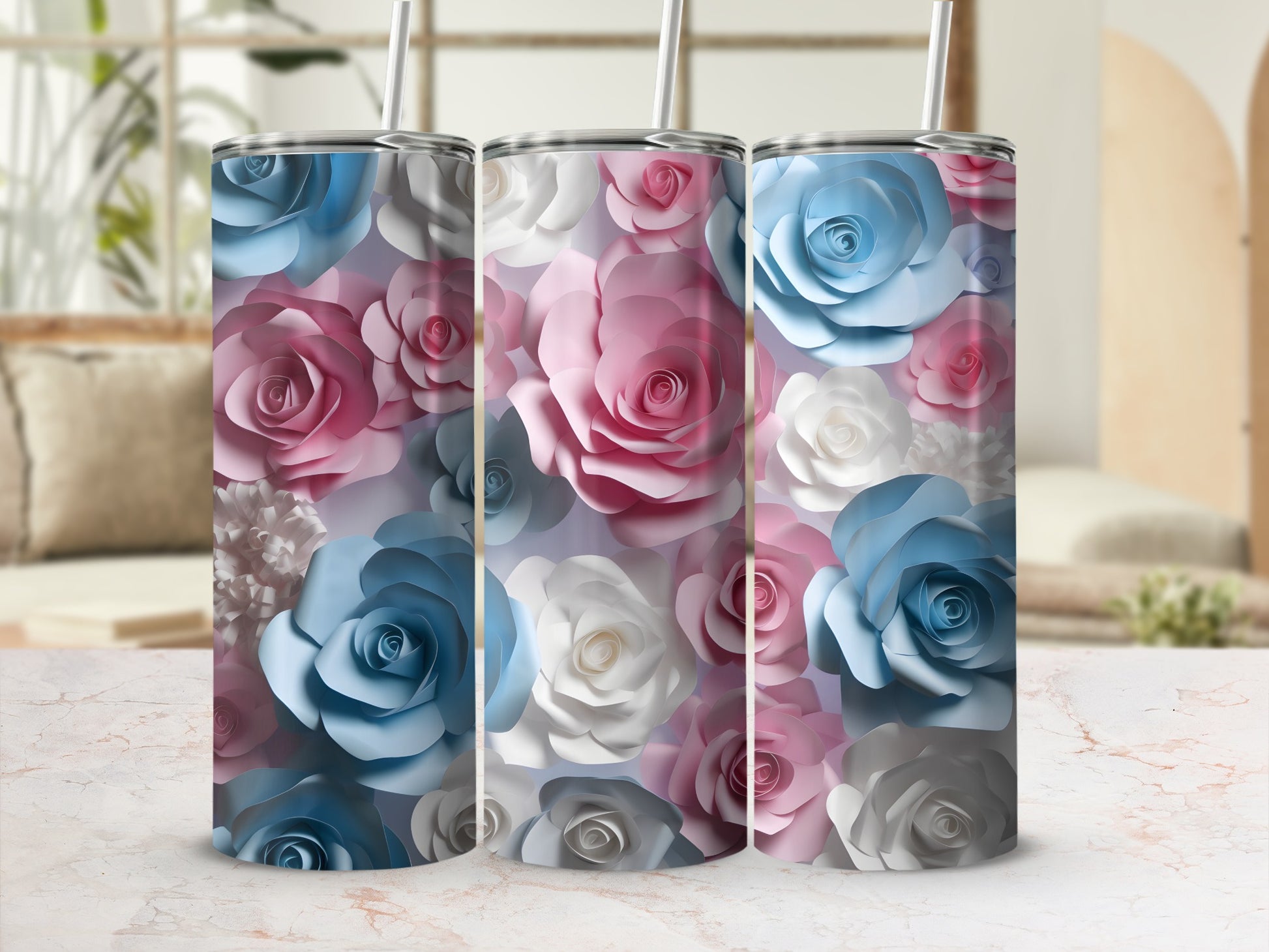Three tumblers with a blue, pink, and white floral design.
