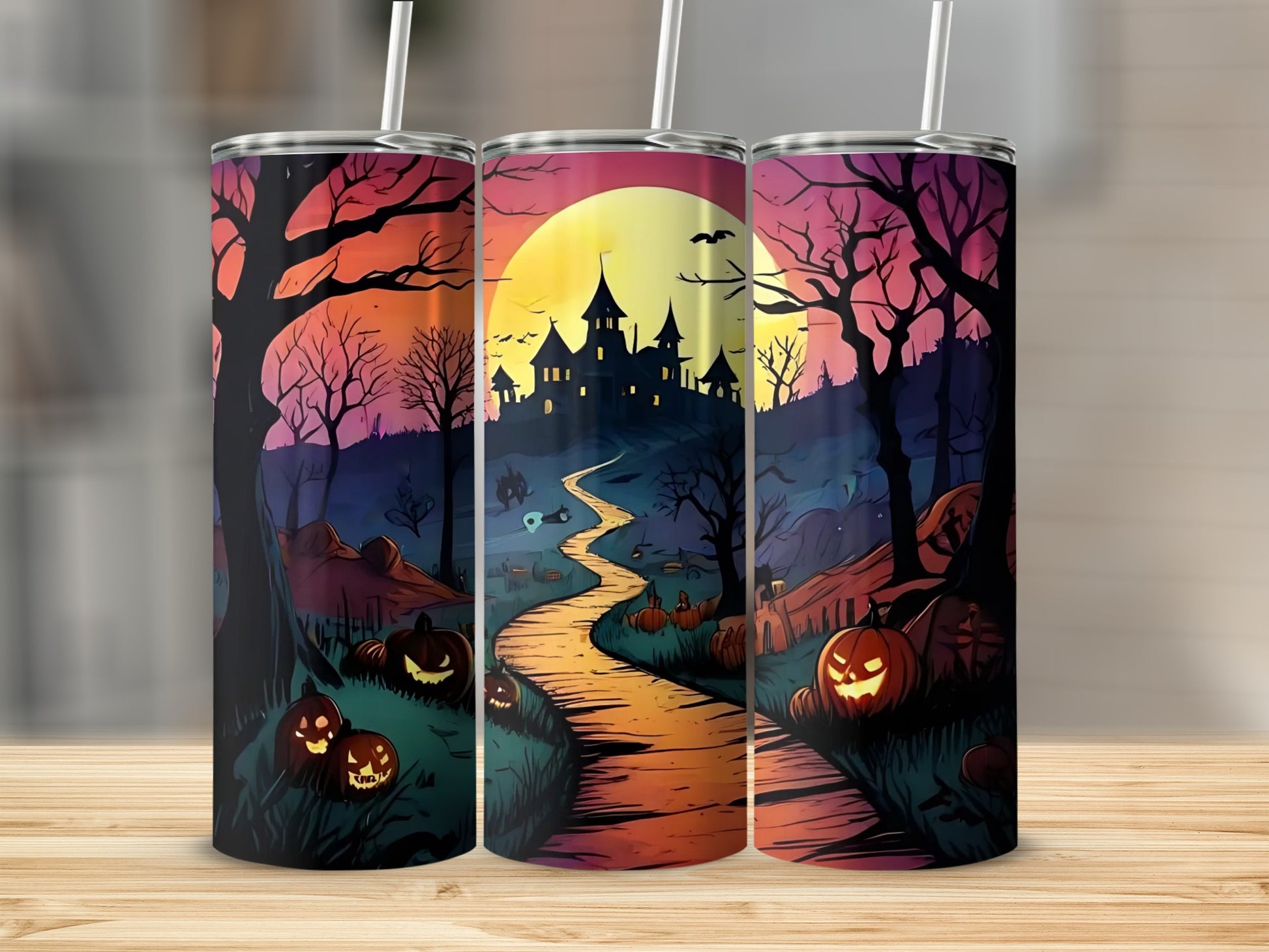 Three tumblers featuring a Halloween scene with a haunted castle, pumpkins, and spooky trees.