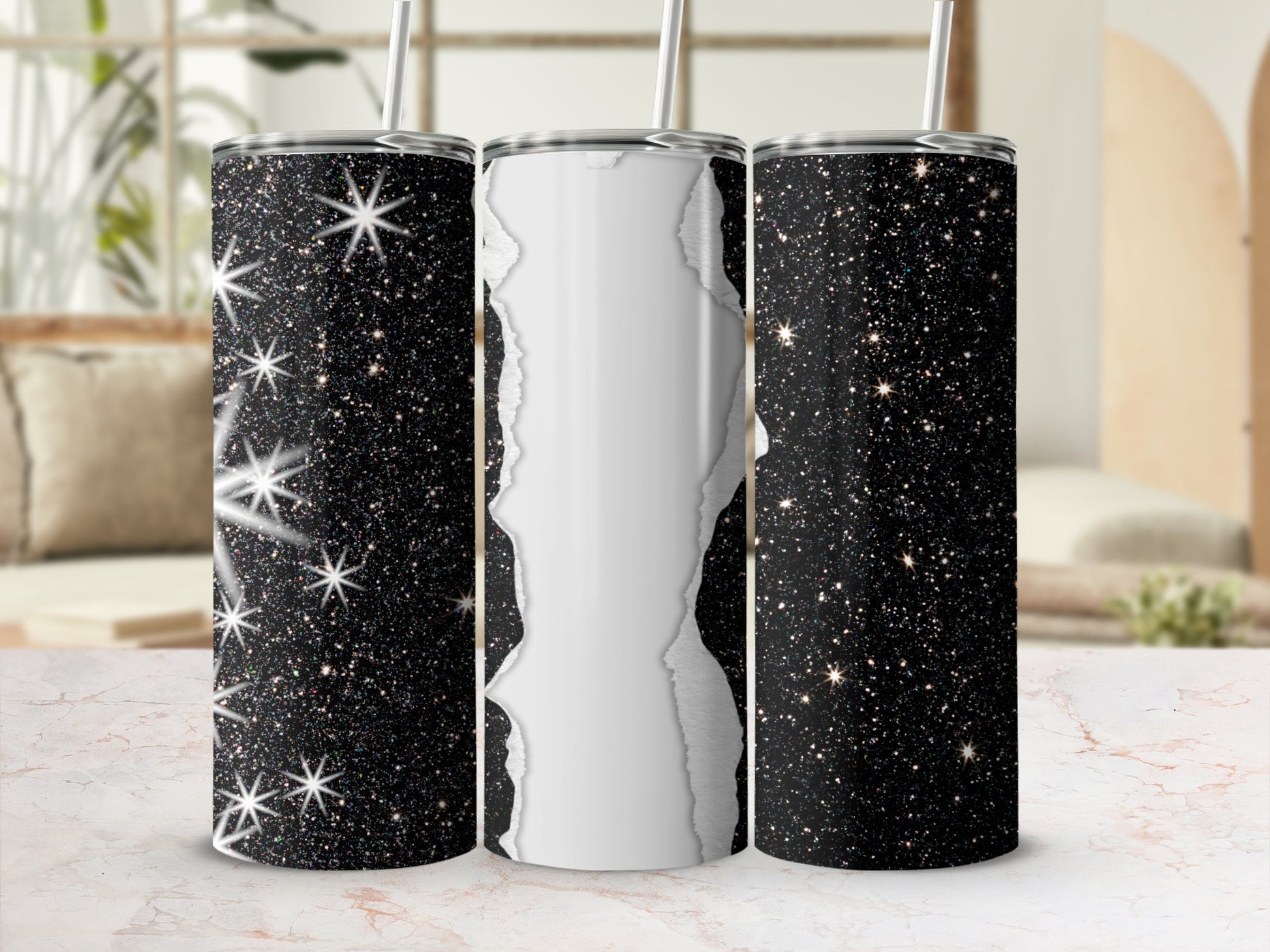 Three sparkly black tumblers with a ripped paper effect on the middle one.