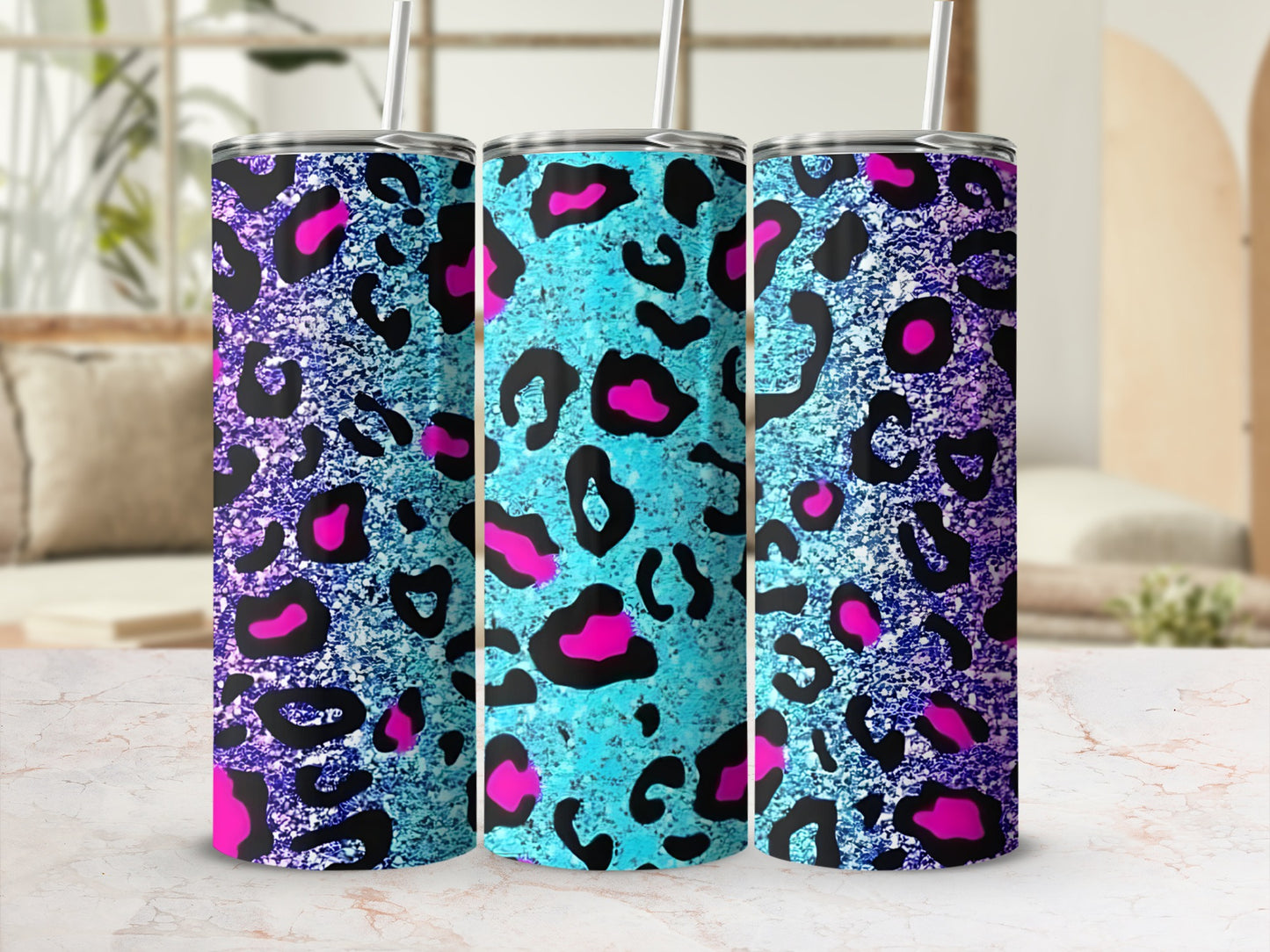 Three tumblers with teal and purple leopard print patterns.