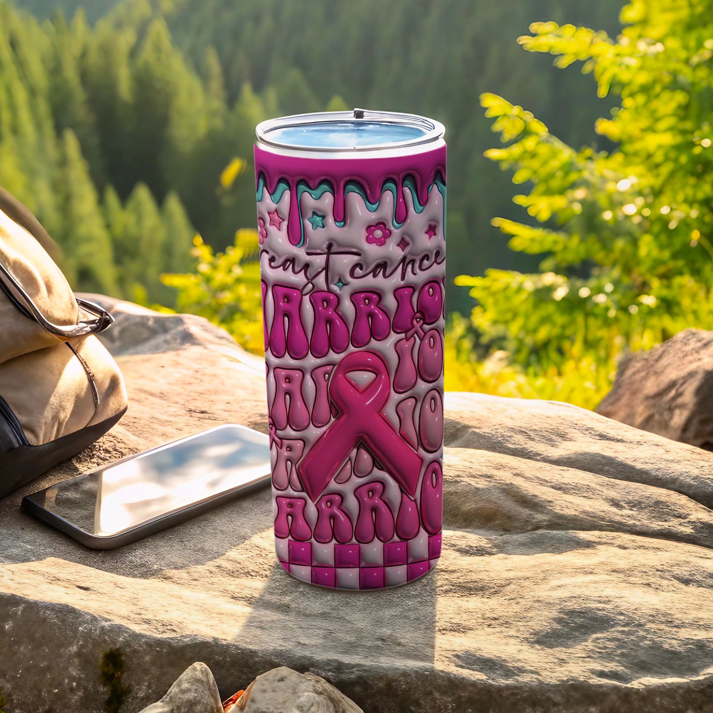 Pink ribbon tumbler with "FIGHT CANCER" text, set outdoors.