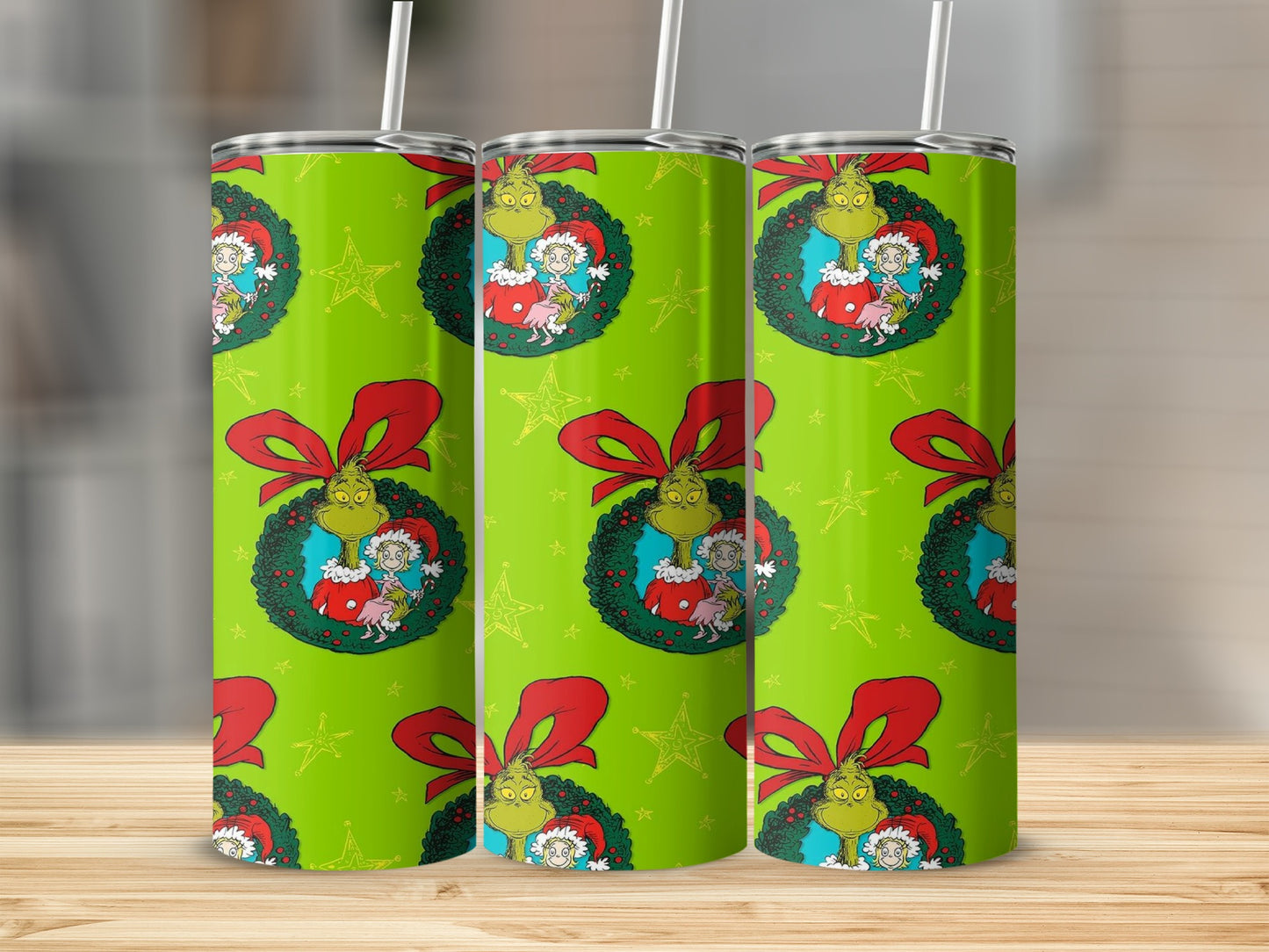 Grinch and Cindy Lou Who in a wreath pattern on a green tumbler.