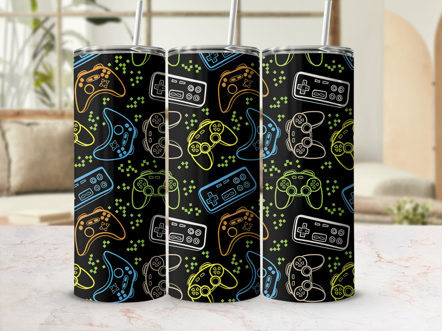 Black tumbler with colorful video game controllers and geometric shapes pattern.