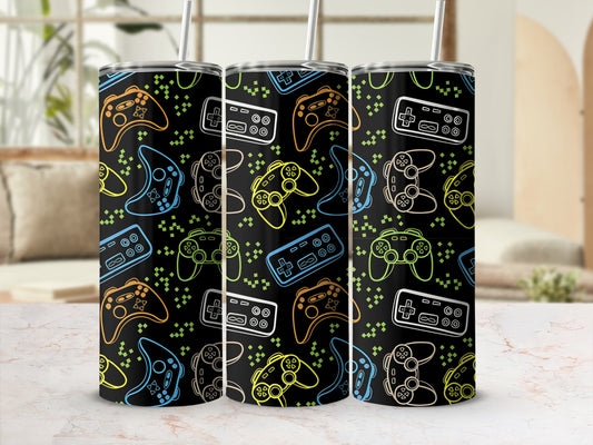 Black tumbler with colorful video game controllers and geometric shapes pattern.
