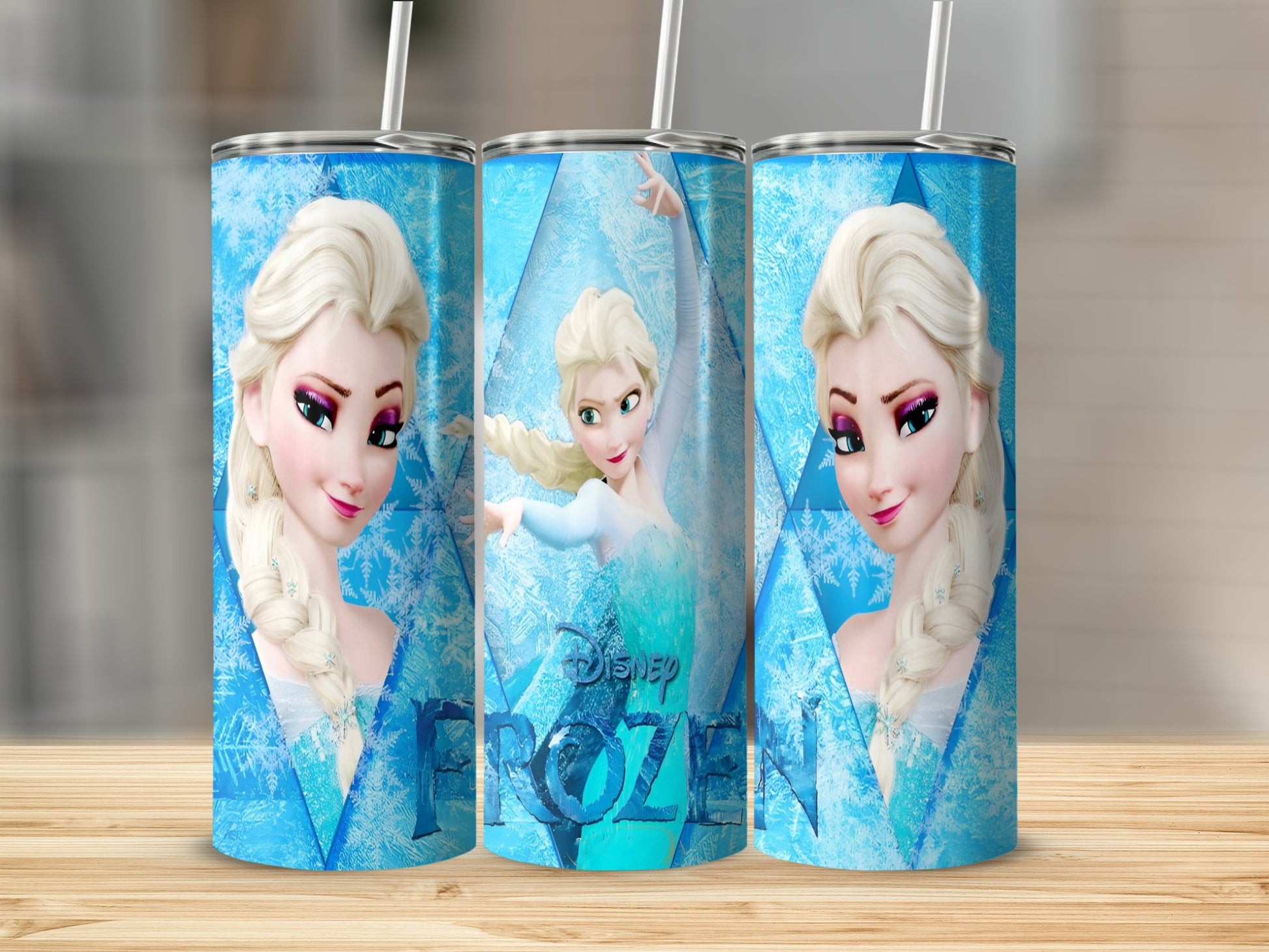 Three tumblers featuring Elsa from Disney's Frozen, with snowflakes.