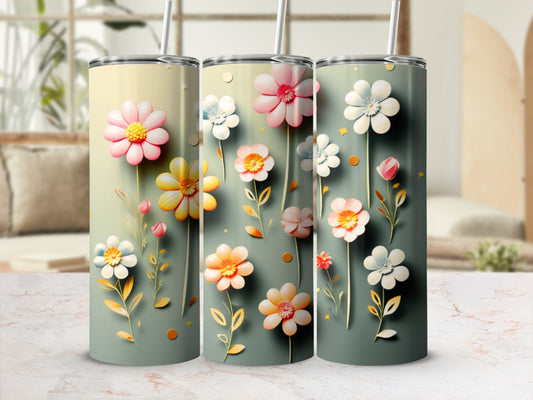 Three tumblers with pastel floral designs, arranged side-by-side.